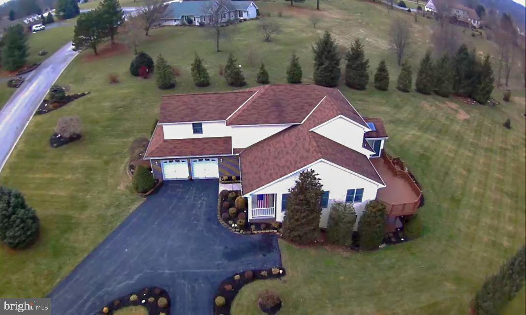 PICTURES REALLY SPEAK FOR THEMSELVES...    THIS GORGEOUS 4 BEDROOM HOME WILL         IMPRESS YOU FROM THE MOMENT YOU WALK IN. OPEN FLOOR PLAN BOASTS OVER 4,500 SQ FT, GORGEOUS SPACIOUS KITCHEN OFFERS     ALL APPLIANCES & GRANITE COUNTERS .            THE  FAMILY ROOM IS COMPLIMENTED W/GAS FIREPLACE & IS  THE PERFECT SPOT TO GET     COZY! MASTER BEDROOM ON EACH LEVEL W/  FULL BATH.  CAPTIVATING SUN ROOM w/           LOADS OF NATURAL SUNLIGHT, VAULTED          CEILINGS & SLIDERS TO GREAT SIZED DECK      FOR ENTERTAINING*OWNERS SUITE + 2             ADDITIONAL GENEROUS SIZED BEDROOMS     ON 2ND FLOOR*OWNERS SUITE HAS LARGE      WIC + JETTED TUB/SEP SHOWER*  THE LOWER LEVEL IS COMPLETELY FINISHED  & OFFERS        POSSIBLE IN-LAW QUARTERS W/PRIVATE             ALMOST 1500 SQ FT INCLUDING A FAMILY        ROOM  & KITCHEN, FULL BATH & AREA THAT       JUST NEEDS 2 WALLS INSTALLED FOR A                 PRIVATE BEDROOM OF 13X14* WATER                 TREATMENT SYSTEM INCLUDED*GORGEOUS       MANICURED GROUNDS*TREMENDOUS DECK* STUNNING VIEWS* WITHIN MINUTES OF             SHOPPING*