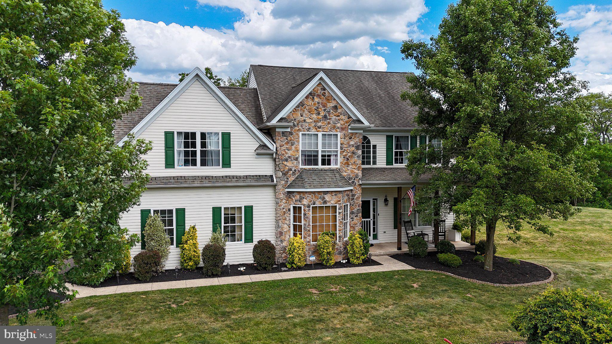 Discover the perfect blend of comfort and elegance in this stunning Colonial-style home, nestled on a generous 1.89-acre lot. Built in 2004, this residence boasts a timeless design with modern amenities, making it an ideal sanctuary for those seeking both style and functionality. Step inside to find a spacious layout that invites you to explore its many features. The heart of the home is the beautifully appointed and updated kitchen, complete with a central island, perfect for casual dining or entertaining guests.  The living space is enhanced by a cozy fireplace, Cathedral ceiling, and natural light providing a focal point for relaxation during cooler evenings. With four well-sized bedrooms, including a master suite that offers ample space for rest and rejuvenation, this home caters to your every need. The bathrooms are thoughtfully designed, featuring a stall shower that adds a touch of luxury to your daily routine. The fully finished basement, complete with an outside entrance, offers endless possibilities-whether you envision a home theater, a playroom, or a personal gym, the choice is yours. The main floor laundry adds to the convenience, making chores a little easier. This home is not just about the interior; it's about the lifestyle it offers. Imagine sipping your morning coffee on the porch, surrounded by the tranquility of nature, or hosting summer barbecues in your expansive yard.  Plan to add your touches like a pole barn, disc golf course, or a volleyball area. The property provides ample parking with a driveway, ensuring that you and your guests can come and go with ease. With high-quality construction materials like vinyl siding and stone, this home is built to last. The condition of the property means you can move in with peace of mind, ready to create lasting memories. Don't miss the opportunity to make this exquisite residence your own. Experience the perfect combination of elegance, comfort, and functionality in a home that truly has it all. Schedule your private tour today and envision the possibilities that await you in this remarkable property! More pictures also coming soon - worth the wait.