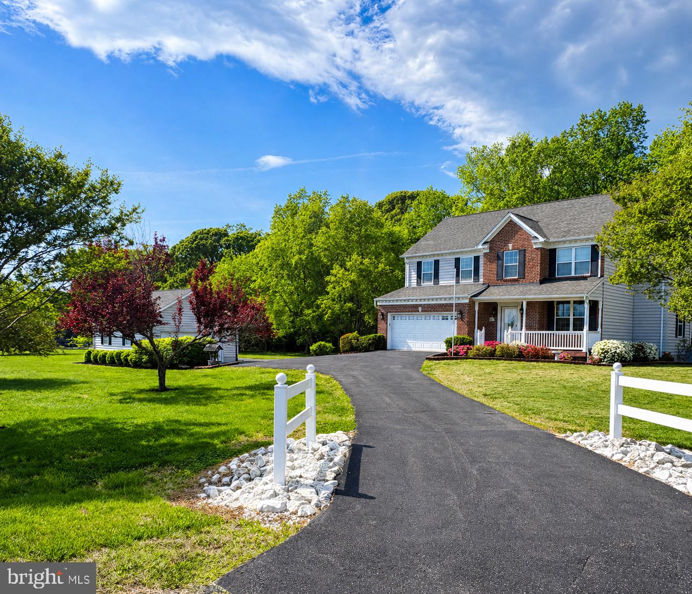 Discover the perfect blend of country serenity and classic craftsmanship in this stately brick-front Colonial. Situated in the Harbourside community, this home offers a spectacular daily view: a working pasture with horses grazing right outside your window. Backing to private woods, this property is a peaceful retreat for those looking to put their own personal touch on a home with "forever" potential.
The interior features a bright and flowing open floor plan!  The kitchen is already equipped with high-quality foundations, including 42" custom oak cabinetry and a new stove. The cozy sunroom with a gas fireplace opens onto a nice deck overlooking the backyard, and the main living area is centered around a warm pellet stove. Upstairs, the primary suite offers a spacious layout with dual closets and a custom-tiled shower, ready to be transformed into a modern spa retreat, plus three additional spacious bedrooms and a laundry room. The partially finished basement offers even more flexible square footage for a home office or recreation room. In addition to the attached garage, you’ll find a massive 24x24 detached garage—an absolute dream for boaters, hobbyists, or anyone needing a serious workshop. Located just minutes from Len’s Marina, Jefferson Patterson Park!
