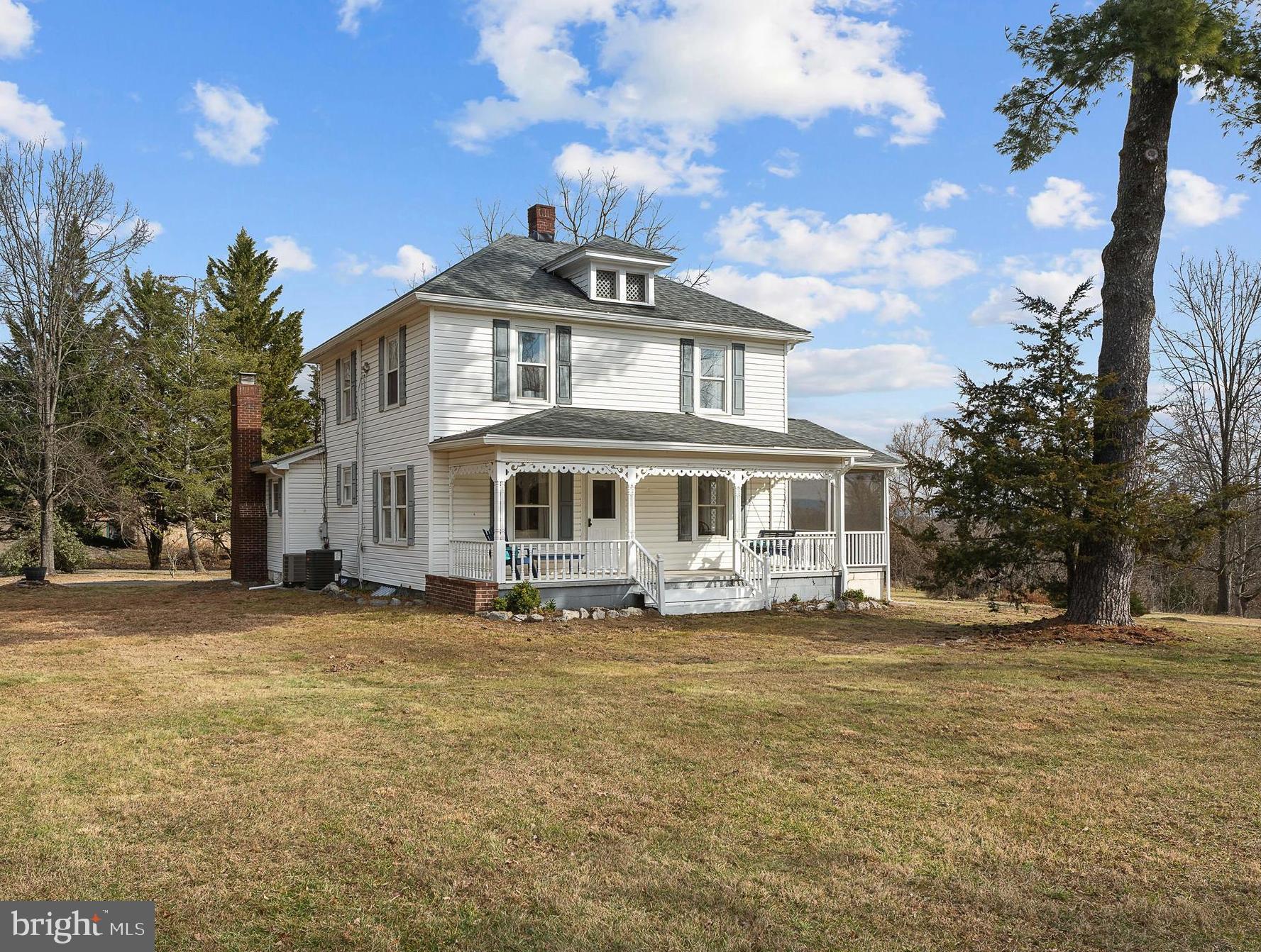 Medium sized house with a big heart in a small town! Seamlessly combining timeless charm and modern comfort, the home was fully renovated in 2023. This traditional four-square farmhouse boasts a new kitchen with quartz countertops, large family room, new bathrooms, restored hardwood floors, and much more! Outside the possibilities are endless on the 2.5 acres of unrestricted land. Close to downtown Berkeley Springs and schools. Schedule a showing today and seize the chance to call this countryside gem your own.