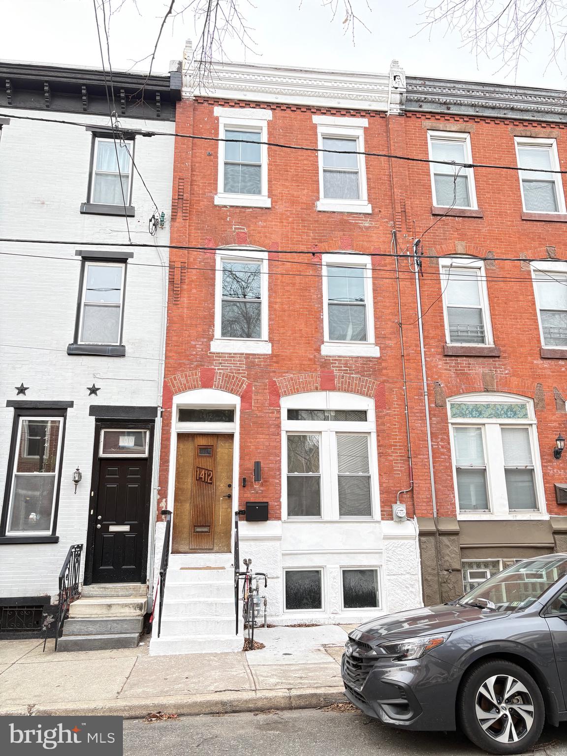 Just steps from Fishtown and Northern Liberties, this newly listed home offers a beautiful blend of historic charm and thoughtful modern upgrades. Spanning three stories, the home features three bedrooms and two full bathrooms, carefully renovated to preserve character while enhancing comfort and style.

The first floor welcomes you with a spacious living room and dining room area, flowing seamlessly into an open-concept layout ideal for both everyday living and entertaining. The new kitchen features Bosch stainless steel appliances, granite countertops, and custom finishes. High-end herringbone hardwood flooring runs throughout the home, complemented by classic details including inlays and a decorative faux fireplace. Step outside to a private rear patio. Enjoy peace of mind with all-new Pella windows and doors in kitchen. 

All staircases throughout the home are brand new, highlighted by custom wrought iron railings with Art Deco–inspired curved balusters, adding architectural interest and continuity across all levels.

The second floor offers two generously sized bedrooms and an updated hall bathroom featuring a double vanity, with herringbone hardwood flooring throughout.

The third floor is dedicated to a luxurious primary suite, complete with a spa-like new bathroom featuring a floor-to-ceiling walk-in shower, seamless glass enclosure, and a freestanding egg-shaped soaking tub, accented by beautiful tile floors and classic white subway tile. This level also provides access to a restored rooftop deck, perfect for relaxing or entertaining.

The finished basement adds valuable living space, ideal as a family room and music room, featuring herringbone hardwood flooring, along with a storage and utility room and a dedicated laundry room with new sink, Bosch washer & dryer.

Additional highlights include tall ceilings, new HVAC, tankless water heater, all-new electrical and plumbing, New lighting & spot light throughout - this can all be connected to your cell phone. Large, dry basement ready for further customization. Priced competitively and located in a prime location.