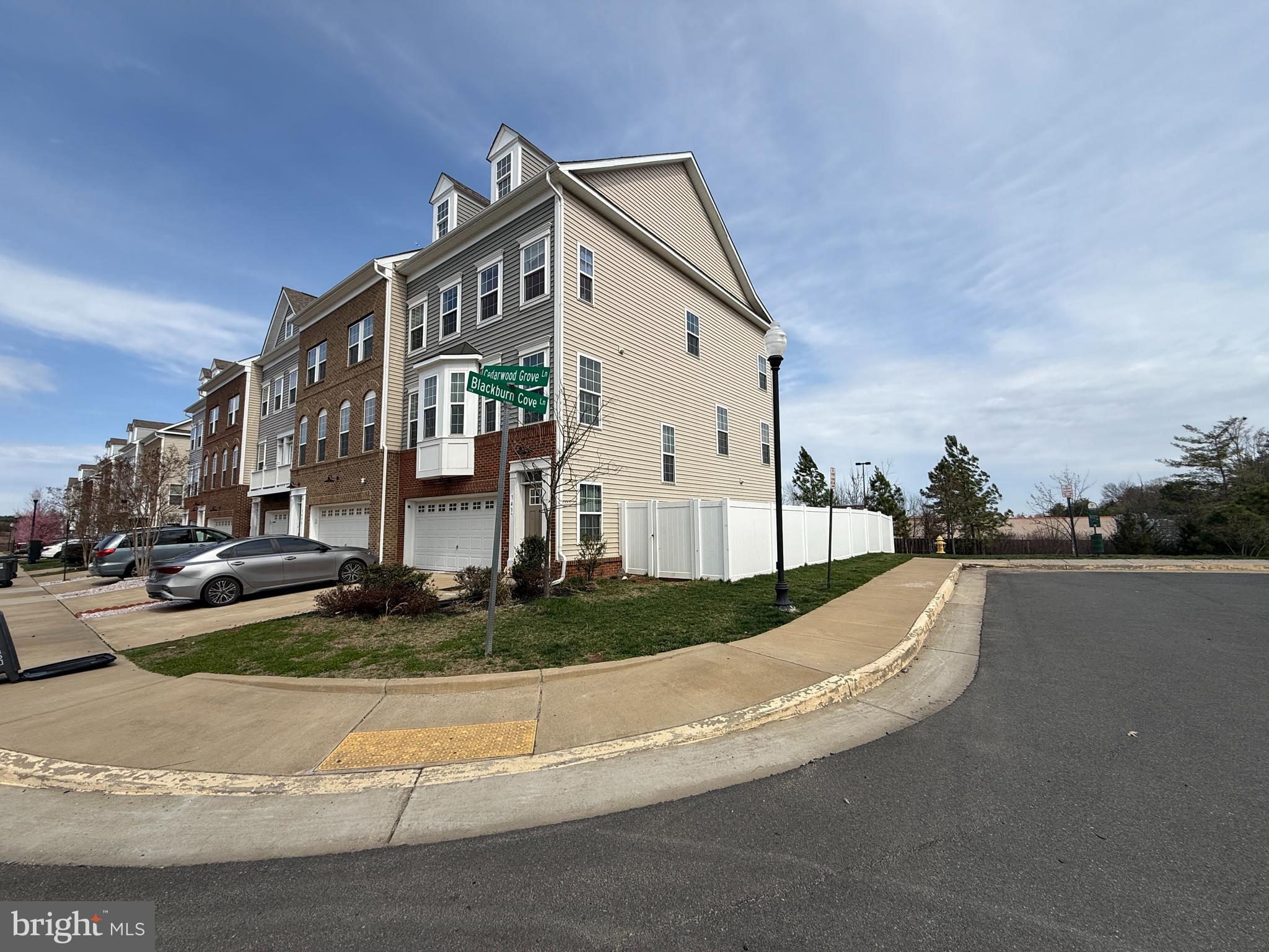Built in 2019, this beautifully maintained end-unit townhome combines modern design, abundant natural light, and an exceptional value. The open-concept main level features luxury vinyl plank flooring and a stunning gourmet kitchen equipped with granite countertops, gas cooking, ample cabinetry, and a spacious center island that's perfect for entertaining family and friends. Step outside onto the low-maintenance composite deck, creating the perfect space to relax, grill, or enjoy your morning coffee.

Upstairs, the spacious primary suite offers a peaceful retreat with a custom walk-in closet and a spa-inspired ensuite bath featuring a luxurious soaking tub. Two additional generously sized bedrooms, a full hall bath, and the convenience of an upper-level laundry room complete the second floor.

The finished walk-out lower level is filled with natural light from sliding glass doors that lead to a fully fenced backyard—ideal for pets, play, or outdoor gatherings. Whether you envision a recreation room, home office, fitness area, or guest space, this versatile level provides endless possibilities.

Perfectly situated with quick access to I-66 and Prince William Parkway, this home makes commuting a breeze while placing you just minutes from popular restaurants, local breweries, shopping, and the charm of Historic Old Town Manassas. Offering style, space, and an unbeatable location, this is a home you won't want to miss.