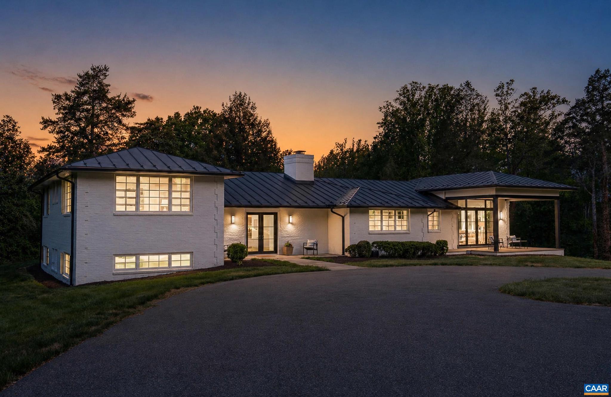 Modern home in Farmington. Privately sited at the end of a lane on 2.64 acres with professional landscaping and views of a neighboring pond. Open-concept design with expansive living spaces, clean lines, and abundant natural light. The main living area features soaring ceilings and a seamless flow between the living room, dining area, and kitchen. Gourmet kitchen with high-end appliances, soapstone countertops, custom cabinetry, and a large island with seating. Main-level primary suite offers a spacious layout, walk-in closet, and a well-appointed bath with oversized walk-in shower and modern finishes. Outdoor living includes a covered patio with stone flooring, ideal for enjoying the private setting and surrounding landscape. Additional features include large-format tile flooring, extensive recessed lighting, and a thoughtful, modern layout throughout. Convenient to Farmington Country Club for golf, tennis, dining, and amenities.,Glass Front Cabinets,Soapstone Counter,White Cabinets,Fireplace in Basement