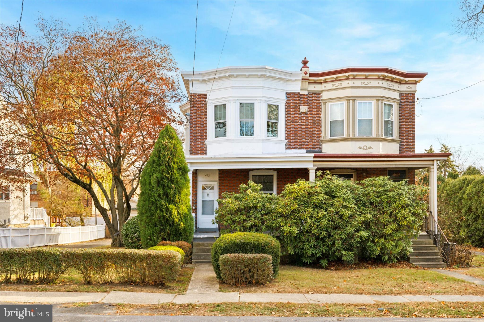 Welcome to this beautifully rehabbed 3-bedroom, 1.5-bath brick twin home that blends modern upgrades with classic charm. Featuring a spacious front porch, long driveway for plenty off street parking and a classic front and back staircase, this home offers both style and convenience. Inside, enjoy an open floor plan with luxury vinyl flooring on the first floor. The inviting living room boasts a faux fireplace, large window, and recessed lighting. The dining room is filled with natural light, offering ample space and a large closet. The eat-in kitchen is a chef's dream, with all new stainless steel appliances, including a French door refrigerator, granite countertops, a stylish ceramic tile backsplash and white shaker cabinetry. The kitchen also features a central island with seating for four, pendant lighting, recessed lighting, a pantry, and access to the rear yard—perfect for entertaining. A convenient 1st-floor powder room  and laundry area completes the main level. A gorgeous staircase leads to the second level, where you'll find three generously sized bedrooms with refinished hardwood floors, plenty of windows for natural light and excellent closet space. The hall bath has been beautifully updated with ceramic tile and features a tub/shower combo. An additional hall closet adds extra storage space. The home also features an unfinished basement, offering potential for storage or whatever your needs are. Located in a highly sought-after area, this property is within walking distance to the local YMCA, shops, schools, and restaurants, making it the perfect blend of comfort and convenience. Don't miss your chance to make this house your home!