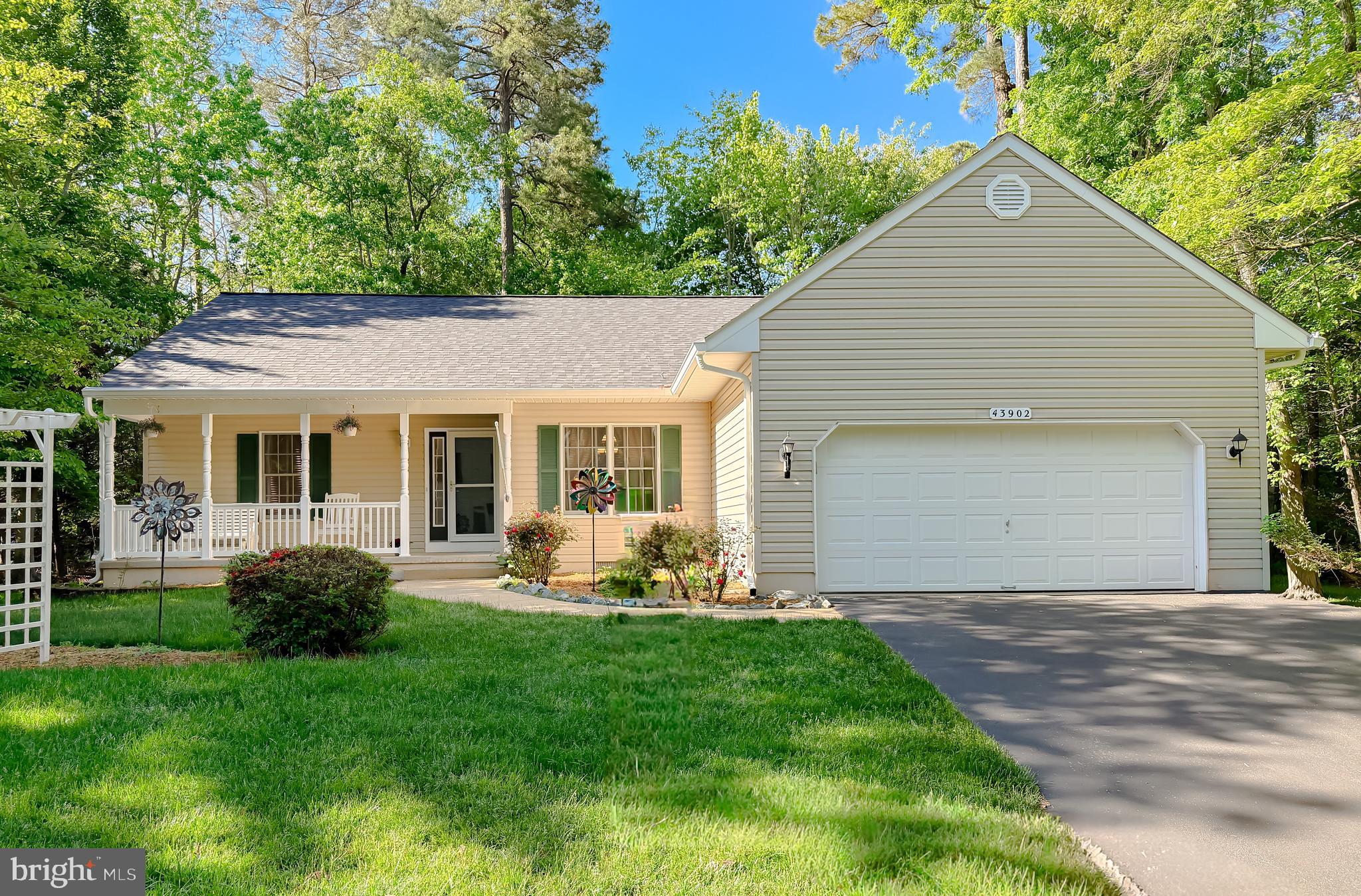 Welcome home to this beautifully maintained rambler with an open floor plan, ideally situated on a quiet cul-de-sac and landscaped corner lot. Offering 4 bedrooms and 2 full baths, this home features heated ceramic tile flooring in the bathrooms for added comfort and luxury. The spacious family room boasts cathedral ceilings and a cozy gas fireplace, flowing seamlessly into the large kitchen with ceramic tile flooring, an eat-in area, and a dedicated formal dining room with French doors - perfect for entertaining. 
Fourth bedroom, off foyer, can also be utilized as a private office/study.  An ideal flex space for working from home! The primary suite offers a large walk-in closet, dual vanities, and heated ceramic tile flooring in the primary bath. Hardwood flooring runs throughout much of the home, with fresh paint and new carpet recently installed in 2 of the 3 bedrooms. Enjoy outdoor living on the large rear deck or covered front porch overlooking the beautifully maintained lawn complete with an irrigation system. Additional highlights include a 2-car attached garage with floored storage space above the garage. Major updates include a new roof installed in November 2022, along with a new HVAC system and hot water heater installed in 2020. Conveniently located close to schools, restaurants, and shopping, and just minutes to PAX NAS! *Note: some photos have been virtually staged to inspire your imagination and help you envision the possibilities this home offers. Schedule your tour today!