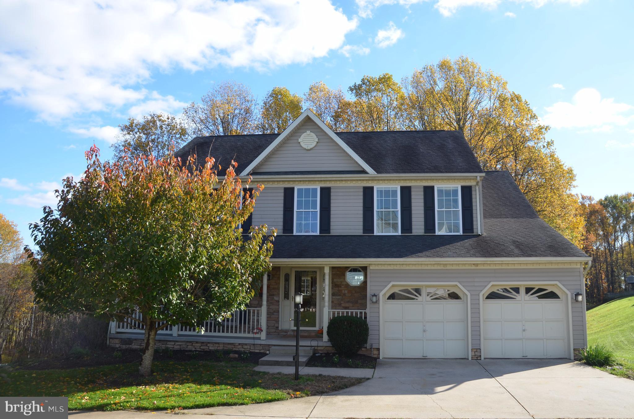 REFRESHED, RE-LISTED, REDUCED & SELLER CONTRIBUTION of $3,000! Wonderful 4 Bed, 2 1/2 Bath HICKORY OVERLOOK Colonial w/ Front Porch, Kitchen/Family Room Combo w/ GAS FIREPLACE & Sliders to LARGE DECK, Lovely Sep. Living & Dining Rooms, 1st FLOOR LAUNDRY, 2 Car GARAGE, FINISHED LOWER LEVEL, Master w/ FULL EN-SUITE BATH, BACKS To WOODS off shared private driveway OPEN SUN. 11/19, 1-3 Come Visit!