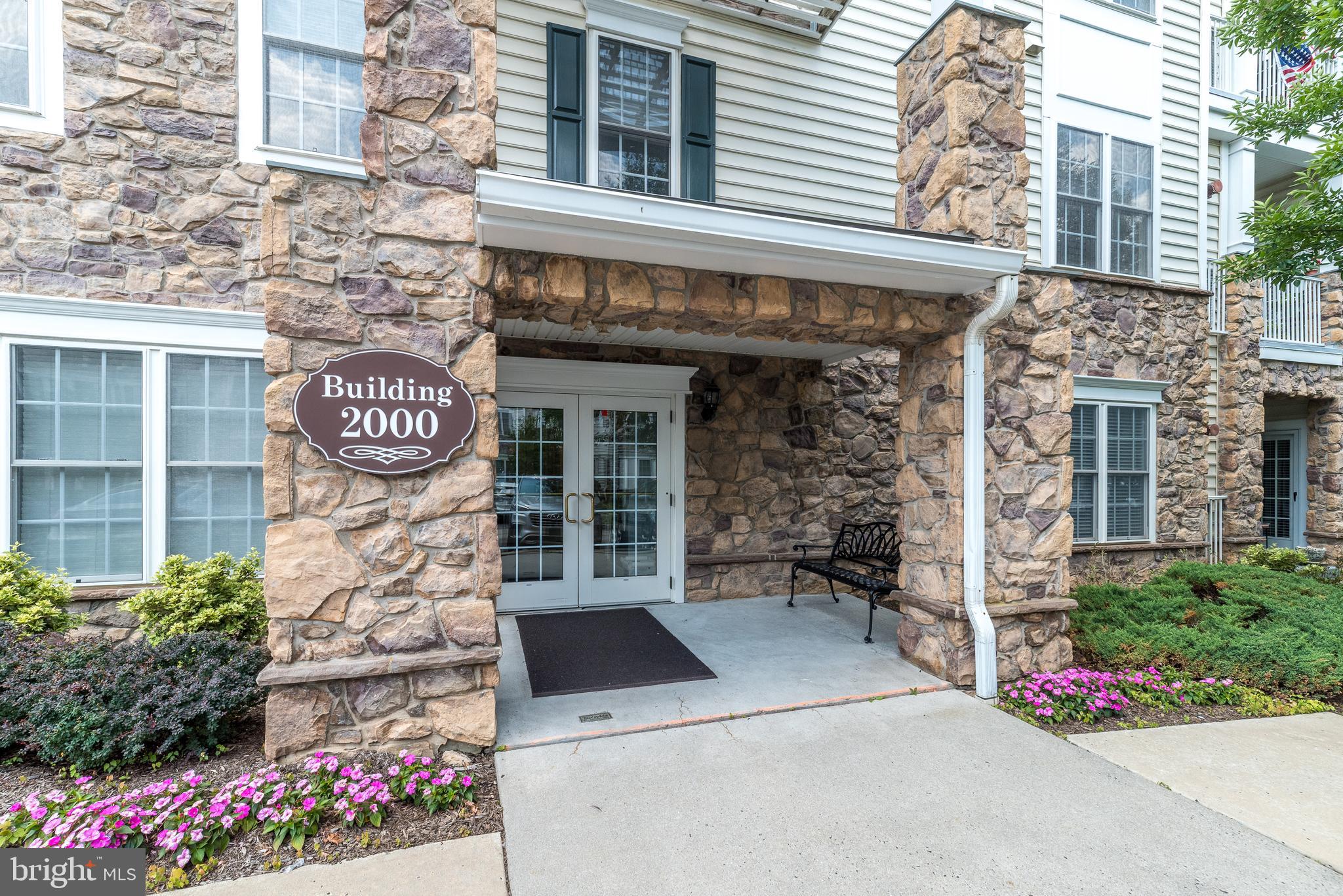 Absolutely stunning Beaumont model in the  award winning ,"The Reserve at Gwynedd". You will LOVE the first floor  corner unit full of windows galore with nice sunny views and in pristine condition! Enjoy CAREFREE living with nothing to do but enjoy all the marvelous amenities this community offers. This bright and spacious corner unit is the largest model with over 1900 square feet of living area with 2 Bedrooms and 2 full Baths.  The Beaumont model has an open floor plan with bedrooms on opposite sides of an open hallway for privacy. Wonderful open floor plan, perfect for everyday living or entertaining friends and family. The elegant dining room features a tray ceiling with beautiful crown molding and wainscoting . The chef's kitchen boasts 42" cherry cabinets, large window, breakfast bar, granite counter tops, and a fabulous spacious custom built pantry for easy storage. Head to the luxurious Main Bedroom Suite and relax with a tray ceiling and large walk-in closet professionally organized even with extra lighting! Main Bath has a double sink vanity,  walk-in shower, soaking tub, and private toilet closet. Bright, sunny and spacious living room with walls of windows offers access to the patio with a great private view where you can unwind and relax after a long day. Nice sized second bedroom with custom closets, can be used for guests, office or den and full hall bath with custom built linen closet. Large laundry room  with laundry sink, extra cabinets and included  newer washer & dryer.  This garden home  includes  an assigned underground parking spot with a storage area in a good location.  Enjoy the beautiful 8000 square foot clubhouse with indoor and outdoor pools, card room, craft room, library, billiards, spacious party room, gym and aerobic rooms. Guest speakers, lectures, and many clubs all coordinated by a full time activity director. You're not just purchasing a garden home, but an active lifestyle.  Make your appointment today!