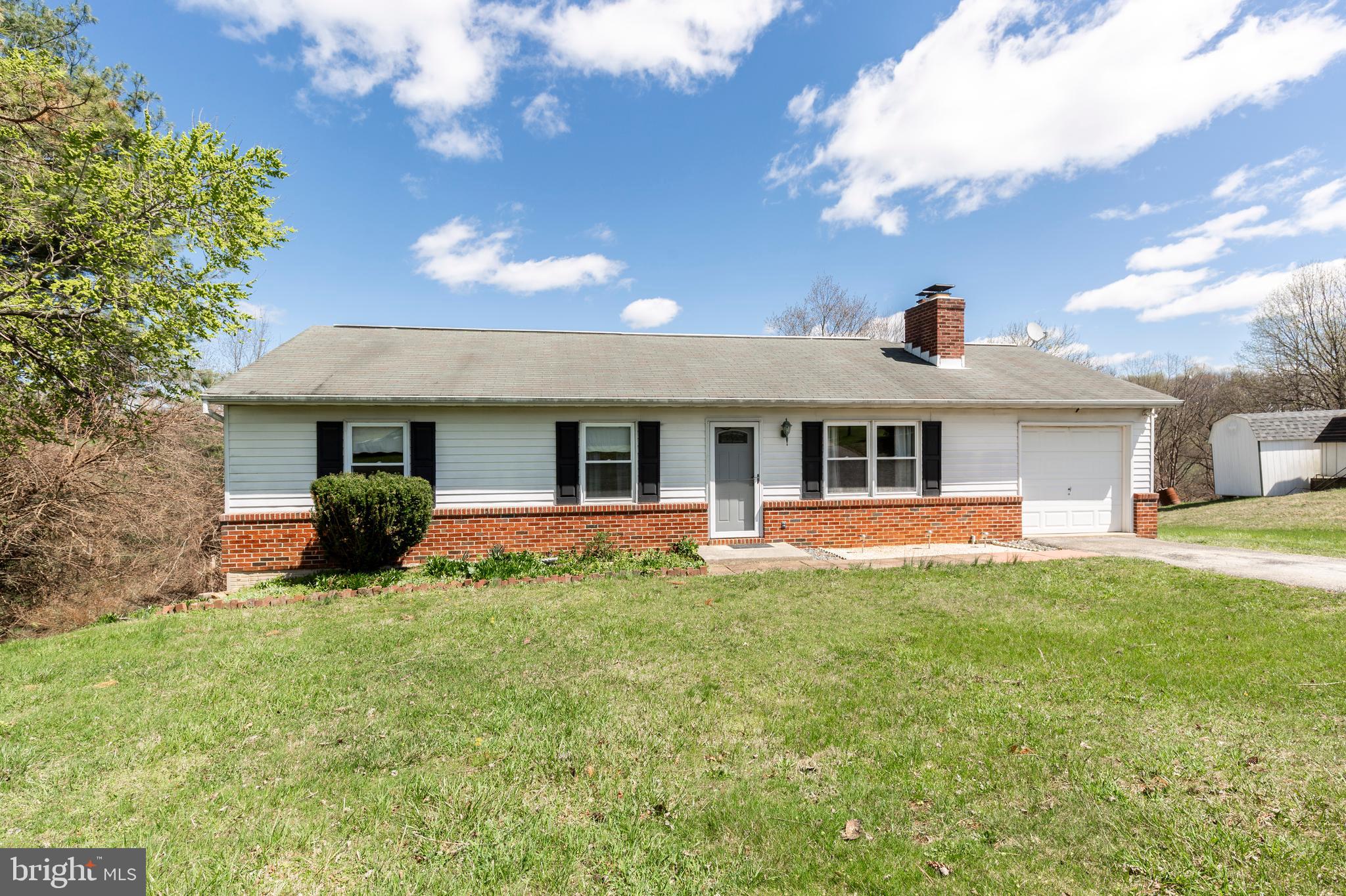 Easy living rancher with three bedrooms and one and half baths located within a community setting. Dining area off the kitchen looks out to mostly cleared lot and backs to a stream and woods.  Main level offers a wood burning brick fireplace includes a heatilator and a pellet stove within the lower level.  The large finished lower level has a walk out level, a huge family room and office area plus a nice size utility room.   Windows have been replaced.  Deck looks out to a parklike setting on a lot size of .64 and not lot of landscaping to maintain to make your weekend chores very limited.  One car attached garage is great for those rainy days or to store your prized possession vehicle.  Make your appointment today to see your next place to call home!