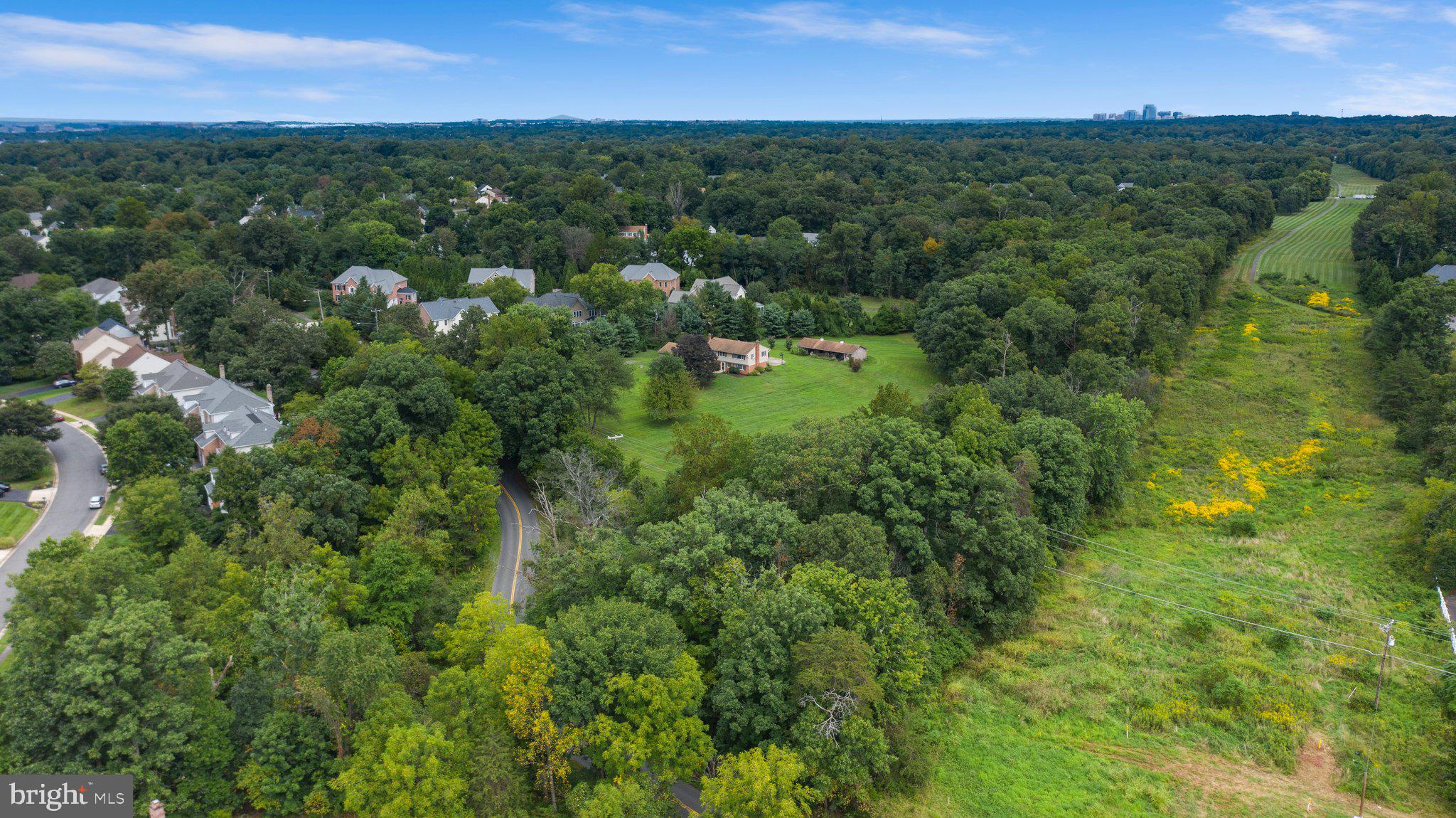 Beautiful 6.4 acres property. Fairfax County Zoned R-1 (Residential 1 DU/AC). Zoning ordinance allows Conventional and Cluster subdivisions. NO HOA. Existing home is well and septic, public water/sewer accessible (sewer easement on the property). Public water/sewer and gas connected to surrounding homes. Home is a Bi-Level design built in 1965 with a pool and barn. Highest and best use is subdividing the land. Oakton HS pyramid. Property borders Oak Hill Reserve and Camberley East subdivisions. Immediate access to Fairfax County Pkwy, close to Rt 28/50. Close to abundant shopping - Franklin Farm Shopping Center and Fair Lakes. New construction homes comp at $2+ million. Spectacular location! The site is ready to build your magnificent homes for enthusiastic, anxious buyers! Don't miss the link to the Drone Video!
