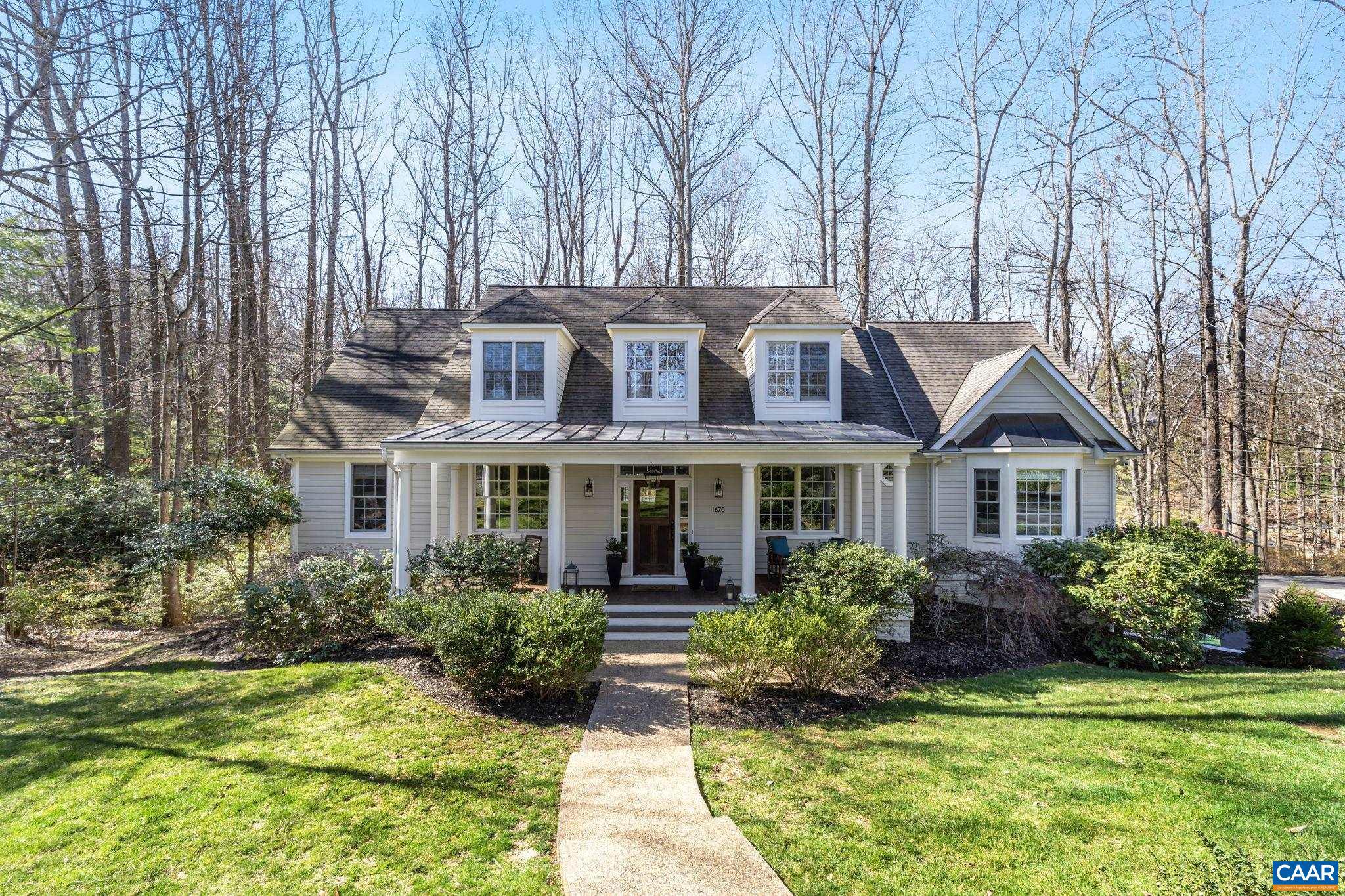 Tastefully renovated five-bedroom home sits in a quiet cul-de-sac overlooking 1.5 acres of private backyard setting in the coveted Flordon neighborhood, minutes to every Charlottesville convenience and amenity. Numerous renovations have created a highly livable home with well-planned spaces & tasteful finishes. Striking a tasteful balance of fine details & modern touches, this home lives graciously, with plentiful spaces for entertaining as well as for relaxation. The welcoming foyer thoughtfully connects the main floor layout between living room, dining room, family room, and gourmet kitchen with breakfast nook leading to an enchanting screened-in porch with stone fireplace. The main level also includes a study & the owner's suite with walk-in dressing room & spacious ensuite bath with dual vanities, marble & tile shower, and soaking tub. Upstairs, three bedrooms and two baths are perfectly situated and equipped. The terrace level offers a bedroom, a rec room or TV room, a fifth full bath & plenty of storage space. The two-car garage provides generous parking. Highlights include the incredible deck off of the family room, multiple fireplaces, gorgeous hardwood floors, custom millwork & built-ins throughout.,Painted Cabinets,Fireplace in Family Room,Fireplace in Sun Room
