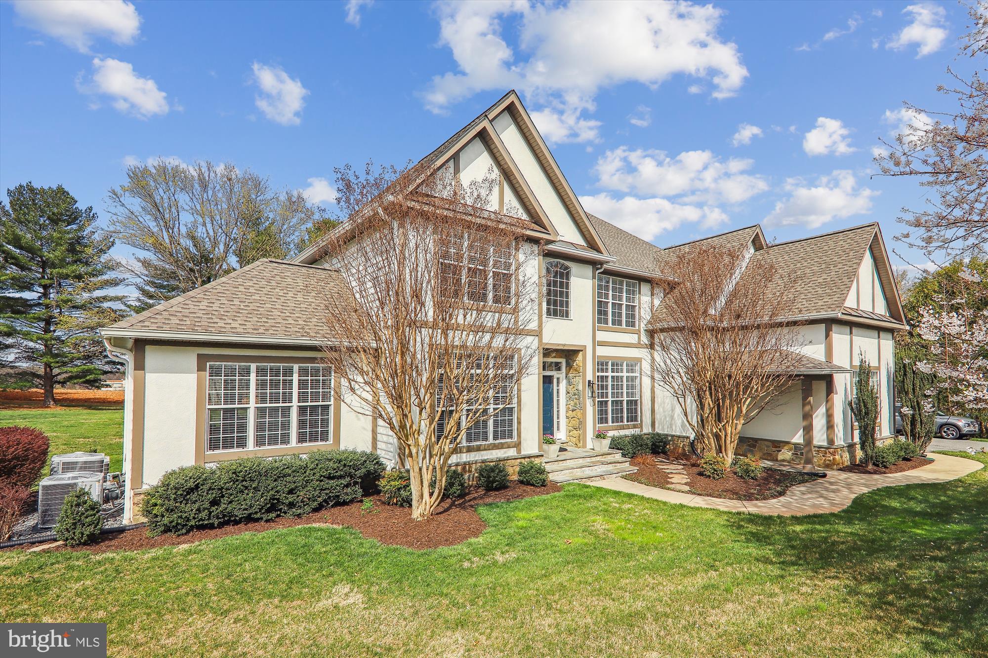 Step into luxury living in the sought-after neighborhood of Darnestown! This stunning three-level renovated Tudor colonial home offers the perfect blend of privacy and convenience. With about 6736 square feet of refined elegance, every detail of this home has been meticulously curated to create an inviting and sophisticated atmosphere. As you step through the front door, you're greeted by soaring 20-foot ceilings that will lead your guests to sophisticated and spacious living areas. The main level features a new chef's dream kitchen, fully equipped with soft-close double-height cabinets, stainless steel appliances, quartz countertops, and a stylish tile backsplash. The kitchen seamlessly flows into the family room, where you can relax as the fireplace whispers, creating an ideal space for entertaining guests or enjoying quiet family nights. The gracious living and dining rooms provide a setting for elegant entertaining with French doors opening to the light-filled sunroom - perfect for morning coffee. The main level also boasts a large office with bucolic views, a powder room, and a convenient laundry area. Throughout the home, you'll find ample natural and elegantly appointed interior lighting that enhances the home's charm and sophistication. The hardwood floors lead you to the upper level and the luxurious primary bedroom suite, complete with two custom walk-in closets, a large sitting area, and a beautifully designed en-suite bathroom for your personal retreat. Three additional bedrooms and two fully renovated bathrooms provide plenty of space for family and guests. But the luxury doesn't stop there! The recently finished lower level offers limitless possibilities where you’ll enjoy an expansive rec room with a wet bar, perfect for entertaining guests or enjoying family movie nights, a bonus room that can be used as an extra bedroom, along with a fully finished bath and loads of storage. Outside, the tranquil, large, flat backyard features two slate patios perfect for outdoor entertaining or simply enjoying a quiet evening under the stars. The sunset view is amazing here. This home offers luxury and peace of mind with a multitude of upgrades, including gas furnaces, a heat pump, a gas hot water heater, new roof/gutters, and many more! Don't miss your chance to experience the epitome of luxury living in Darnestown – schedule your private tour today!