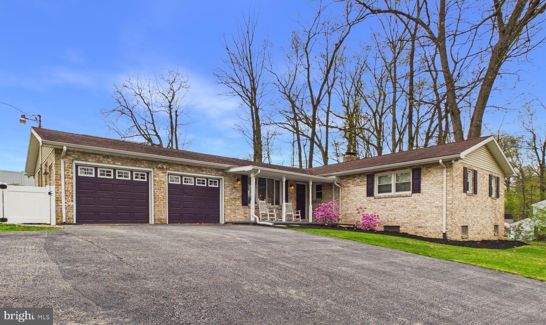 Come take a look at this beautifully updated all-brick rancher situated on a half-acre lot! Enjoy a private setting while still being conveniently close to schools and local amenities.

The home features an updated kitchen complete with a farmhouse sink, granite countertops, tile backsplash, and recessed lighting. The spacious living room offers a cozy wood-burning fireplace—perfect for relaxing evenings. The main level also includes a formal dining room and a conveniently located laundry room just off the kitchen.

The primary bedroom boasts his-and-her closets along with a private en-suite bath. The hall bathroom has been tastefully updated with dual sinks, luxury vinyl tile flooring, and a tub/shower combination.

Downstairs, the finished lower level provides a large family room plus two additional versatile rooms ideal for a home office, playroom, or exercise space. There’s also ample storage in the unfinished area where the home’s mechanical systems are located.

Step outside to enjoy the large covered patio and spacious backyard—perfect for entertaining or unwinding. Additional highlights include an oversized two-car garage & plenty of parking.
Schedule your showing today!
* Click on movie camera Icon for 360 Tour. 
ONE YEAR HOME WARRANTY INCLUDED