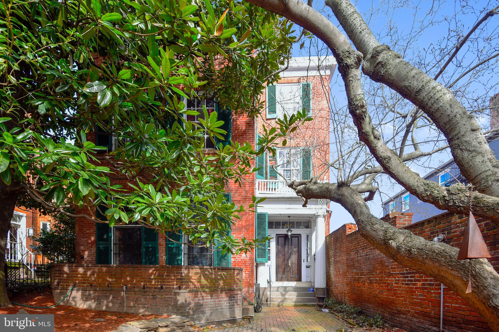 A RARE AND WONDERFUL OPPORTUNITY TO OWN THE GOVERNOR GEORGE HOWARD HOUSE, a Baltimore City Landmark!  As a detached townhouse, the home receives beautiful sunlight from the east, south and north.  With great charm and architectural interest, this handsome house was built in 1845 (+/_) and includes the main house, a three-story carriage house and lovely front and rear gardens. The owner's quarters on all three floors  within the main house, encompass spectacular entrance foyer, front stair hall with eliptical staircase, living room with fireplace, spacious dining room, kitchen, mudroom and generous pantry. Owner's elevator serves floors 1-3.  On 2nd and 3rd floors rear, there's a small one-bedroom apartment.  Carriage house features two garage spaces at street level; upstairs on 2nd and 3rd floor,  a spacious apartment provides solid income.  Renovated approximately 15 years ago, the carriage has spectacular sunlight and very appealing living spaces.  Property does not possess a multi-family license; rental registrations have not been completed.  Small apt.on 2nd & 3ed floor rear is NOT air conditioned.