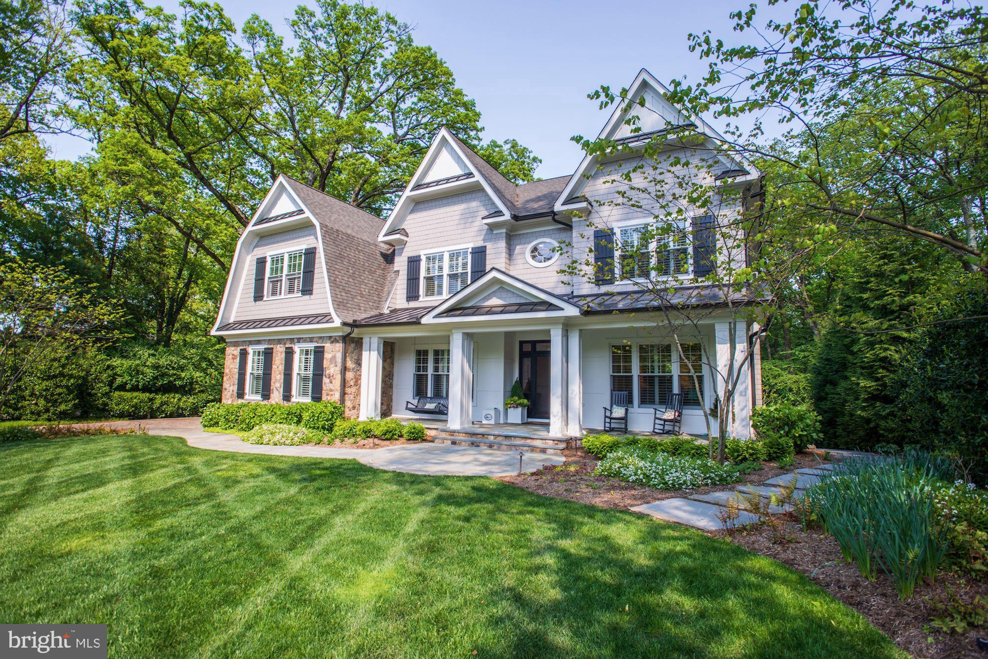 Exquisite offering in McLean's Franklin Park.  Gracious and stunning Nantucket-style custom home, top to bottom detailing offering the utmost in refinement.  The level of sophistication is immediately captured upon entering this beautiful home.  Customized throughout by Kristin Peake Interiors, this home is a showcase for modern day refined elegance, easy family living & casual entertaining. The front formal rooms provide elegant entertainment spaces, which connect via Butler's pantry (including under cabinet Sub-Zero refrigerator drawers, beverage fridge & wine fridge) and front foyer to the open kitchen and family room.  These rooms are both afforded magnificent views of the half acre rear yard and lead seamlessly to the screen porch and the entirety of the outdoor living space.  A custom-built mudroom leads to the 3-car side loading garage, which is outfitted with 3 EV charging stations.   The upper level of the home features a beautiful master suite with separate sitting room (with integrated beverage fridge), two walk-in closets and state of the art bath finishings including heated flooring, a walk-in shower with 14 shower heads, 3 temperature controls and steam shower.  3 additional bedrooms, all with en-suite bathrooms, are also on this level.   The stunning lower level features a lovely guest bedroom and bathroom, a theater room, fitness room, recreation space and opens to a truly exceptional and expansive outdoor living space.  Outdoor living at its finest, the multi-tiered living, dining and recreation areas include: screen porch, outdoor kitchen, fire pit, putting green and open lawn space.  A stunning setting in a most coveted location.