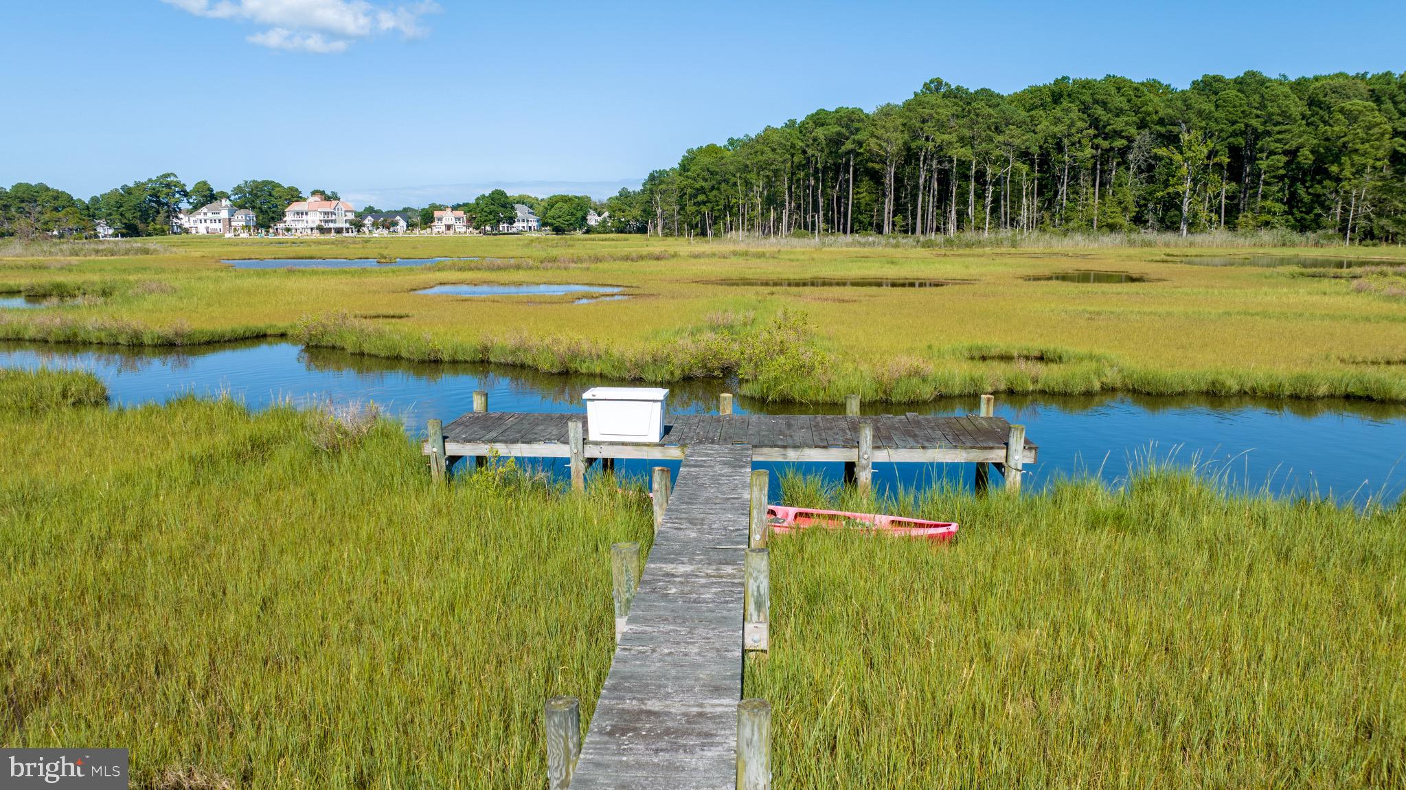 Building Envelop Survey as well as Wetland Delineation Just Completed!!!!!!!!
Welcome to Lot 27 in the South Point community of Indian Creek. This isn't just land; it's your future slice of paradise! With 8.1 acres, 1.43 of which are buildable, you've got the perfect canvas to bring the coastal home of your dreams to life. And talk about a room with a view—you'll have water access to Newport Bay and Sinepuxent Bay right in your backyard.

Feeling social? You're joining a welcoming, tight-knit community of just 32 lots and custom homes. Yet with this much space, your peace and quiet is also guaranteed. Plus, you're only a quick drive from Assateague Island's natural beauty and the fun vibes at Ocean City Golf & Yacht Club. The best of both worlds!

You'll share a 300-foot dock with Lot 26  that's suitable for kayaking, paddle-boarding and relaxing. And no worries about paperwork; a perk test has already been completed, and the county has it on record.

So, if you're tired of the daily hustle and want to come home to a place that's all your own, Lot 27 is waiting for you. Grab this chance to make your dream home a reality in a place that truly offers the best of both worlds.

Minimum Home Sqft size is 2500 first floor and 3000 Minimum total home size