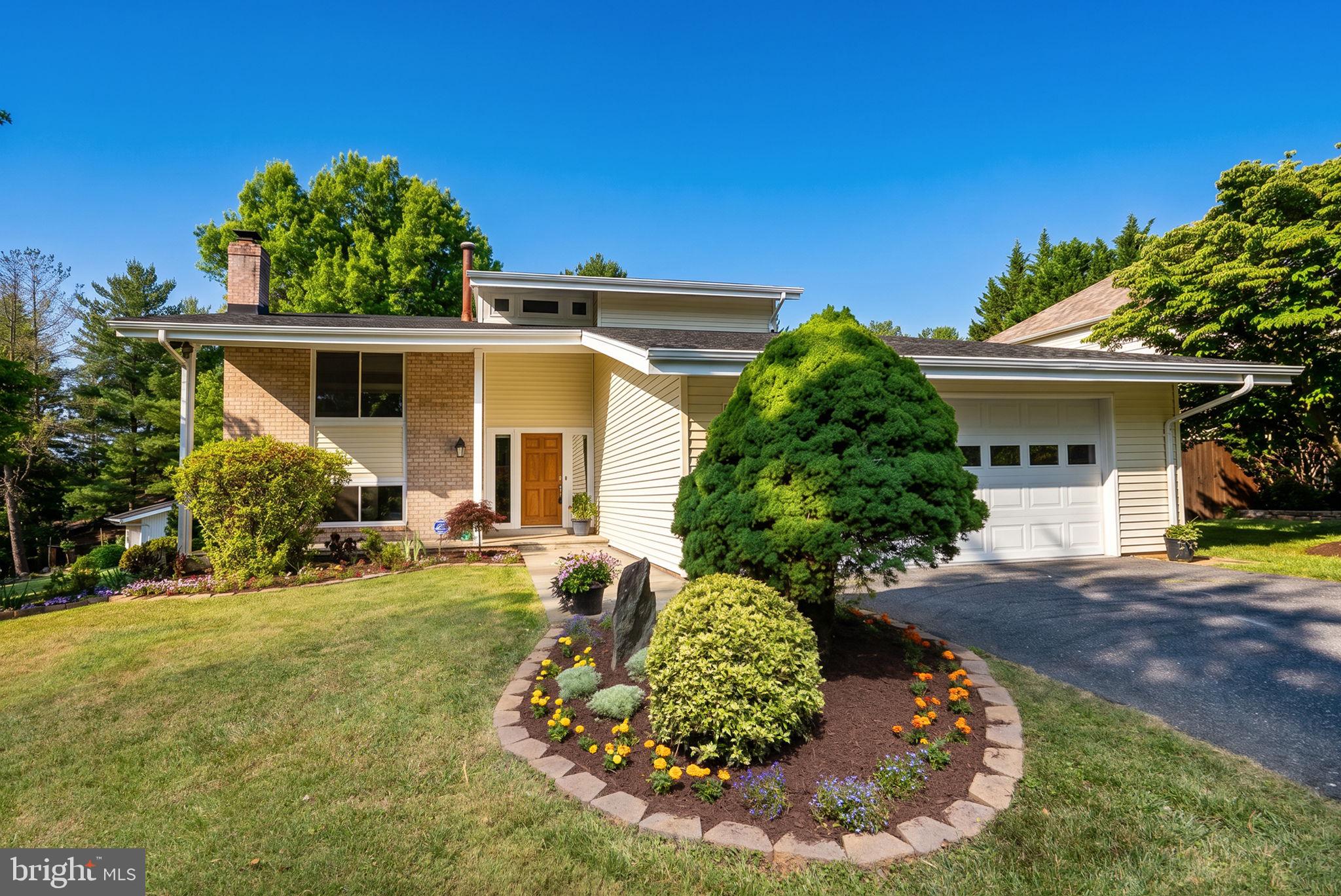 Nestled on a premium corner lot in the heart of Potomac, this beautifully maintained contemporary home offers five bedrooms, two full and one half baths, spacious multi-level living, thoughtful updates, and an exceptional location within one of Montgomery County's most sought-after communities.

A dramatic vaulted foyer welcomes you inside, where soaring ceilings, abundant natural light, and gleaming hardwood floors create an inviting atmosphere throughout. The spacious living room showcases floor-to-ceiling windows overlooking the private, landscaped backyard, expansive patio, and deck, while two sliding glass doors provide seamless indoor-outdoor living and entertaining.

The eat-in kitchen is thoughtfully designed for both everyday living and hosting guests, offering direct access to the garage and outdoor entertaining spaces. A stainless steel KitchenAid appliance suite—including a refrigerator, gas range, dishwasher, and microwave—combines style, functionality, and convenience.

The second level features three generously sized bedrooms and an updated full bath enhanced by a skylight that fills the space with natural light. Just a few steps above, a versatile loft overlooks the main living area and backyard, creating the perfect setting for a home office, reading nook, or creative retreat. The private primary suite occupies its own level and offers three closets, an updated bath, and a peaceful sanctuary separated from the home's main living areas.

The lower level provides exceptional flexibility with a dedicated media room anchored by a wood-burning fireplace, along with an additional bedroom or home office featuring backyard views. The finished basement expands the living space even further, offering a spacious recreation room with a bar and pool table area, a separate fitness room, a den or guest room, a full-size laundry room, and abundant storage.

Outdoor living is equally impressive, with a large deck, expansive patio, and beautifully landscaped fenced backyard providing privacy and ample space for entertaining, recreation, and pets. Ideally situated directly across from the Eldwick Swim Club, park, playground, basketball courts, and tennis courts, the home offers unmatched convenience for an active lifestyle.

Numerous recent improvements provide peace of mind, including a newer roof, replacement windows with energy-efficient UV-protective glass, updated interior and exterior doors, upgraded attic insulation and ventilation, a well-maintained  HVAC system with  two compressors, a new garage door opener, and fresh paint throughout.

Additional features include Lutron smart lighting, Decora switches throughout, Nest thermostats, ADT security wiring, and Verizon FiOS fiber-optic internet. Located within the highly regarded Churchill school cluster—including Wayside Elementary, Hoover Middle School, and Winston Churchill High School—and just minutes from Potomac Village shopping, dining, parks, and the Potomac Community Center, this move-in-ready home offers a rare combination of architectural character, flexible living spaces, thoughtful improvements, and an exceptional Potomac location.
