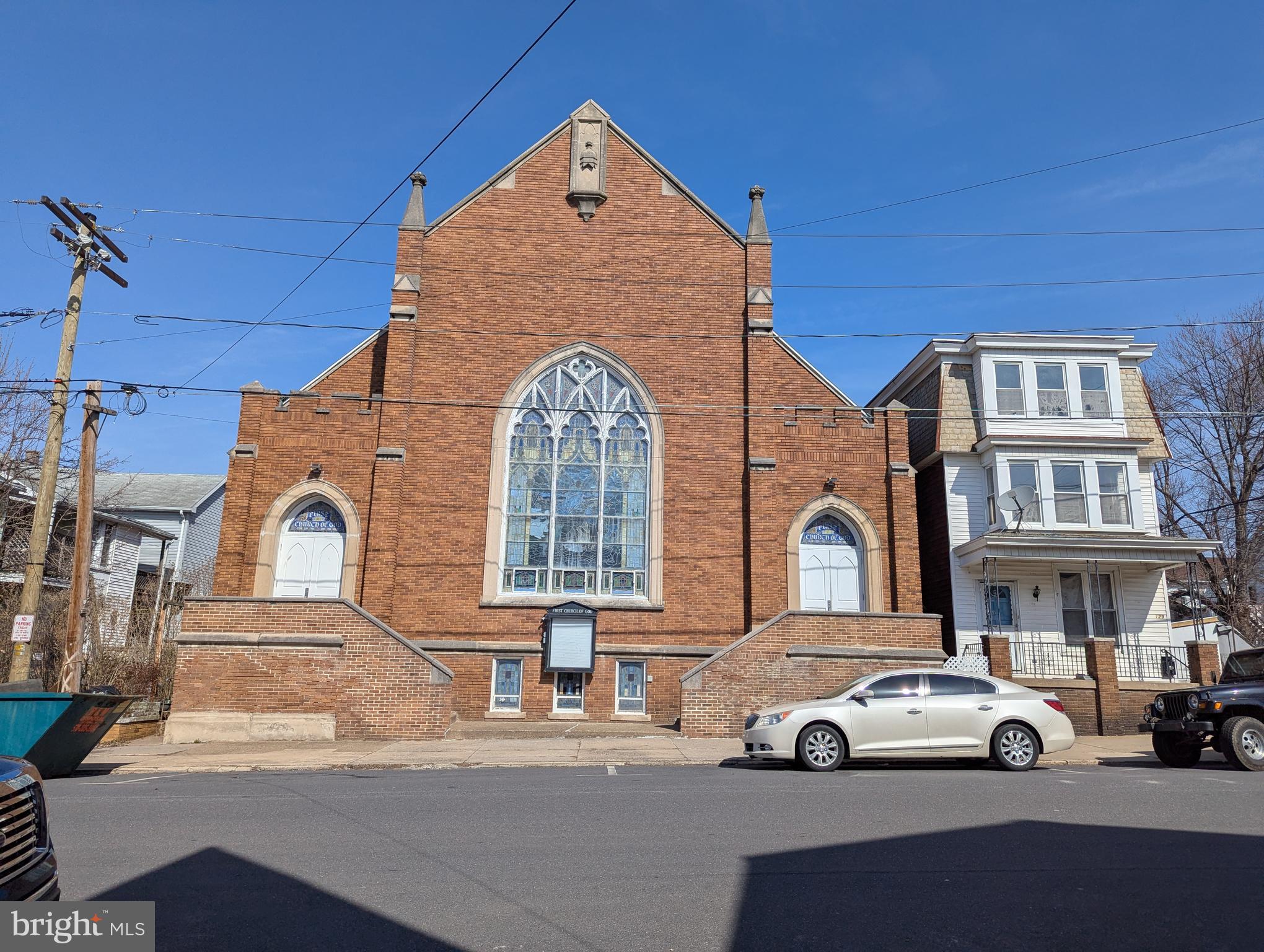 This unique property features a church alongside a separate rectory, offering dual income potential. The rectory can be rented for additional revenue, after renovations, making this an ideal opportunity for investors seeking a versatile asset. A convenient location enhances its appeal. It is perfect for continued religious use, community events, or potential redevelopment with zoning approval, so buyer due diligence is encouraged. Don’t miss out on this exceptional potential income-generating property!