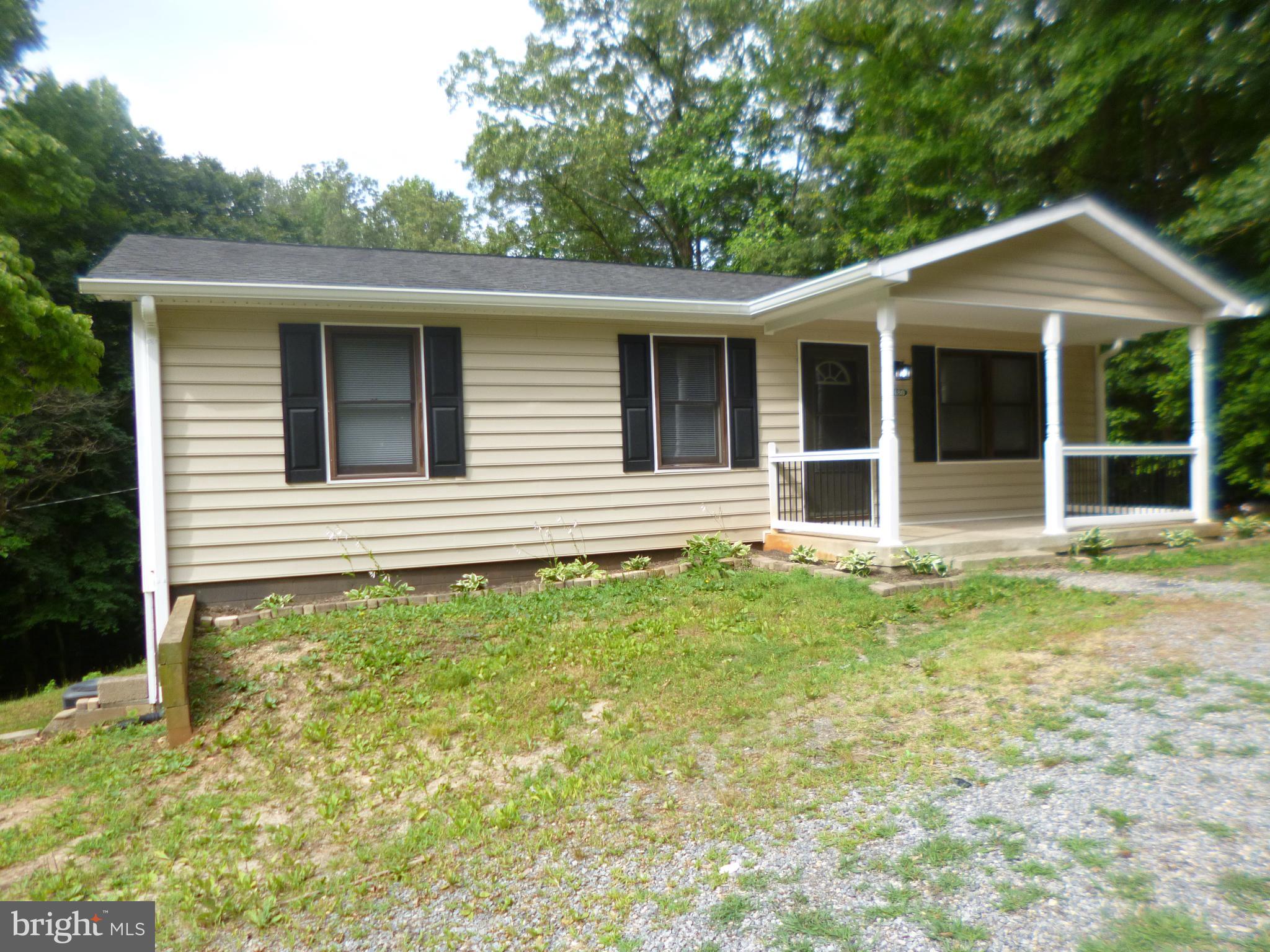 WOW! Looking for space  to expand!  Well cared for home situated on pastoral lot with full UNFINISHED 
 heated Basement * Virtually maintenance free with new siding, new deck,  roof approximately 8 years old, new drain field within last 6 years *updated kitchen , appliances, flooring (washer/dryer "as is")   In addition to walk out level basement there is a 22 x 12 heated storage   area that makes a great workshop, Man Cave ,  Bike storage or additional heated living space, Corner lot, circular drive. 

 YOU won't be disappointed  ** Located in Caroline Pines, a serene,  beautiful lake-oriented community located in Ruther Glen, Va. featuring swimming pool,  fitness center, play ground, community room ,community track and Lake DeJarnette..


Commuting access via I-95 and Route 1 to Richmond and Fredericksburg.