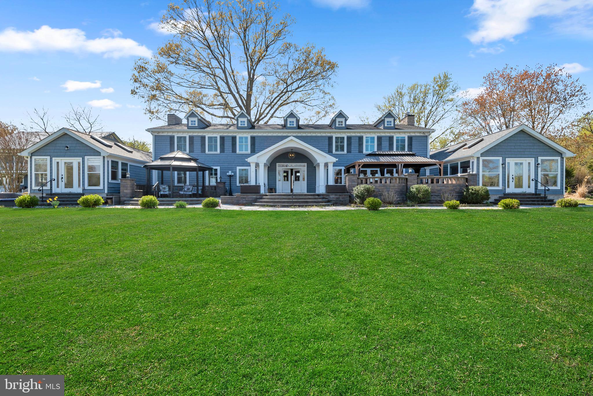 Rare opportunity to own a 10,000+ sq ft waterfront estate on 6.03 private acres along Rockhold Creek in Deale, MD. Featuring 11 bedrooms, 12 full bathrooms, and 1 half bath, this expansive property offers a unique combination of luxury living, income potential, and event-ready functionality.

With 120+ feet of waterfront and two private piers with multiple dock slips, this property provides direct navigable access for boating, kayaking, and waterfront recreation. The rip-rapped shoreline enhances durability while maximizing usability of the shoreline.

The main residence offers a flexible, open layout with multiple living and entertaining spaces, high ceilings, and a commercial kitchen, making it ideal for large gatherings, hosting, or catering support. A detached two-story guest house/in-law suite provides additional accommodations, perfect for extended stays, multi-generational living, or rental use.

Additional highlights include parking for 20+ vehicles, expansive open and wooded grounds, and multiple indoor/outdoor entertaining areas. Built in 1978 and renovated in 2021, the property blends scale, privacy, and functionality.

This property is exceptionally well-suited for a variety of uses, including a luxury short-term rental (Airbnb/VRBO), waterfront wedding or event venue, corporate retreat, wellness retreat, bed & breakfast, or private family compound.

Located in Anne Arundel County with convenient access to Annapolis, the Chesapeake Bay, and commuting routes to Washington, DC, this is a rare large-scale waterfront offering with limited comparable inventory.

Whether you are seeking a private estate, an income-producing property, or a one-of-a-kind event destination, this property delivers unmatched versatility and potential.
