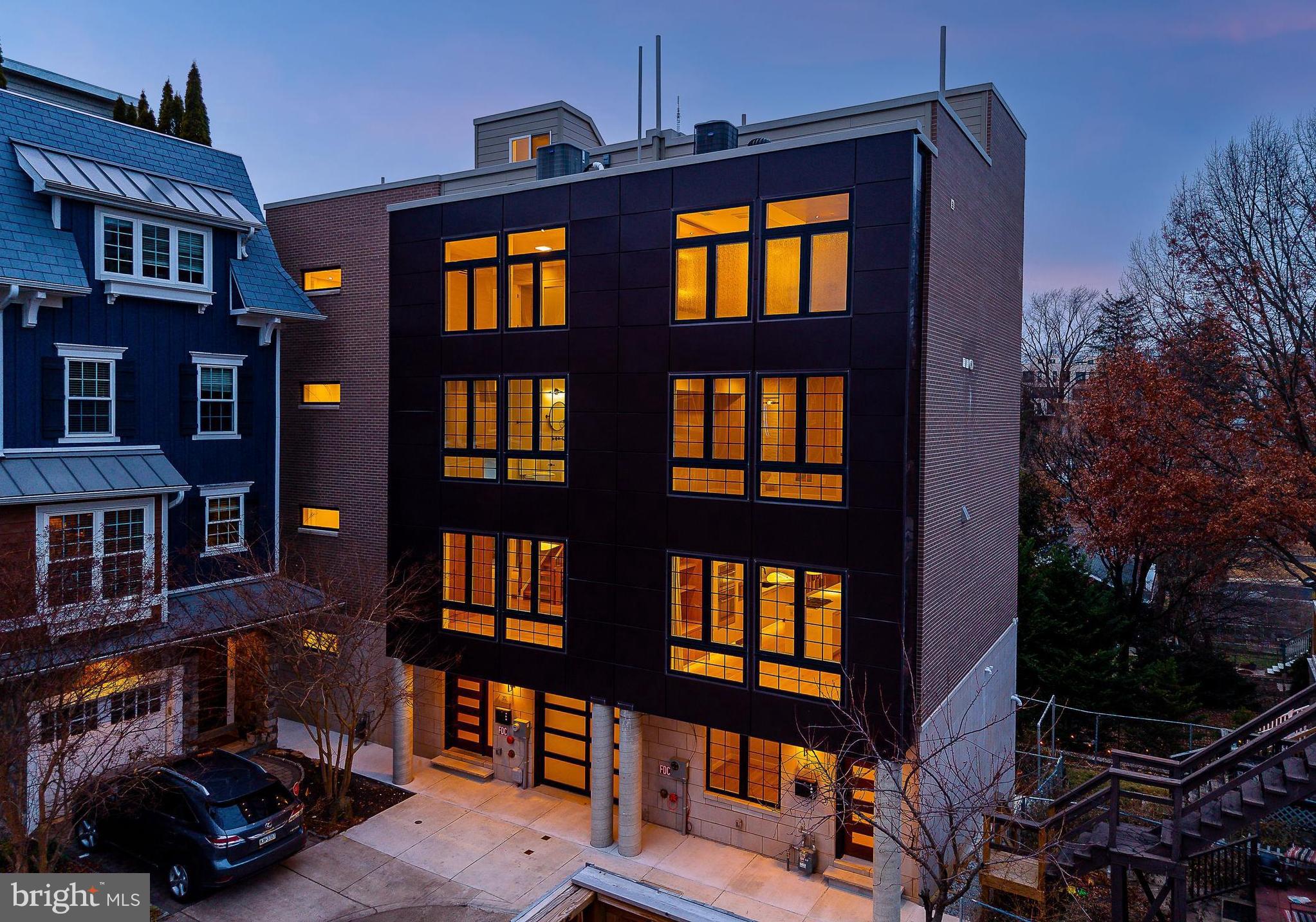 Welcome to an exceptional luxury townhome on one of Manayunk’s most desirable blocks. Another project built by Finch Development and meticulously designed by Mishel Pareará, offering breathtaking views and uncompromising design at every turn. This 4-bedroom, 4.5-bath residence was thoughtfully curated with top-tier finishes, custom craftsmanship, and smart-home features throughout.

The home features radiant heated floors, electric custom window treatments, and designer wood wall paneling and cabinetry throughout, all selected and executed by a professional designer. An elevator services all levels, providing seamless comfort and convenience.

The chef’s kitchen is a true showpiece, featuring a Thermador built-in counter-depth refrigerator, high-end appliances, custom cabinetry, and a sleek, modern layout designed for both entertaining and everyday living. Engineered hardwood floors run throughout the home, complemented by designer wallpaper and integrated Sonos sound systems on four levels.

The fully finished basement includes a gas fireplace and a wet bar, creating the perfect space for entertaining or relaxing. An additional wet bar in the primary suite adds a rare touch of luxury. The spacious primary bedroom also features custom walk-in closets and spa-like finishes.

Additional highlights include heated garage parking, a built-in wine refrigerator and dishwasher, an exceptionally large laundry room, and custom-designed closets throughout, all thoughtfully integrated to elevate both daily living and entertaining.

Located on an outstanding block in Manayunk, this home offers the perfect combination of privacy, luxury, and access to one of Philadelphia’s most vibrant neighborhoods—known for its dining, shopping, trails, and community feel.

A truly rare offering where design, technology, and location come together flawlessly.
