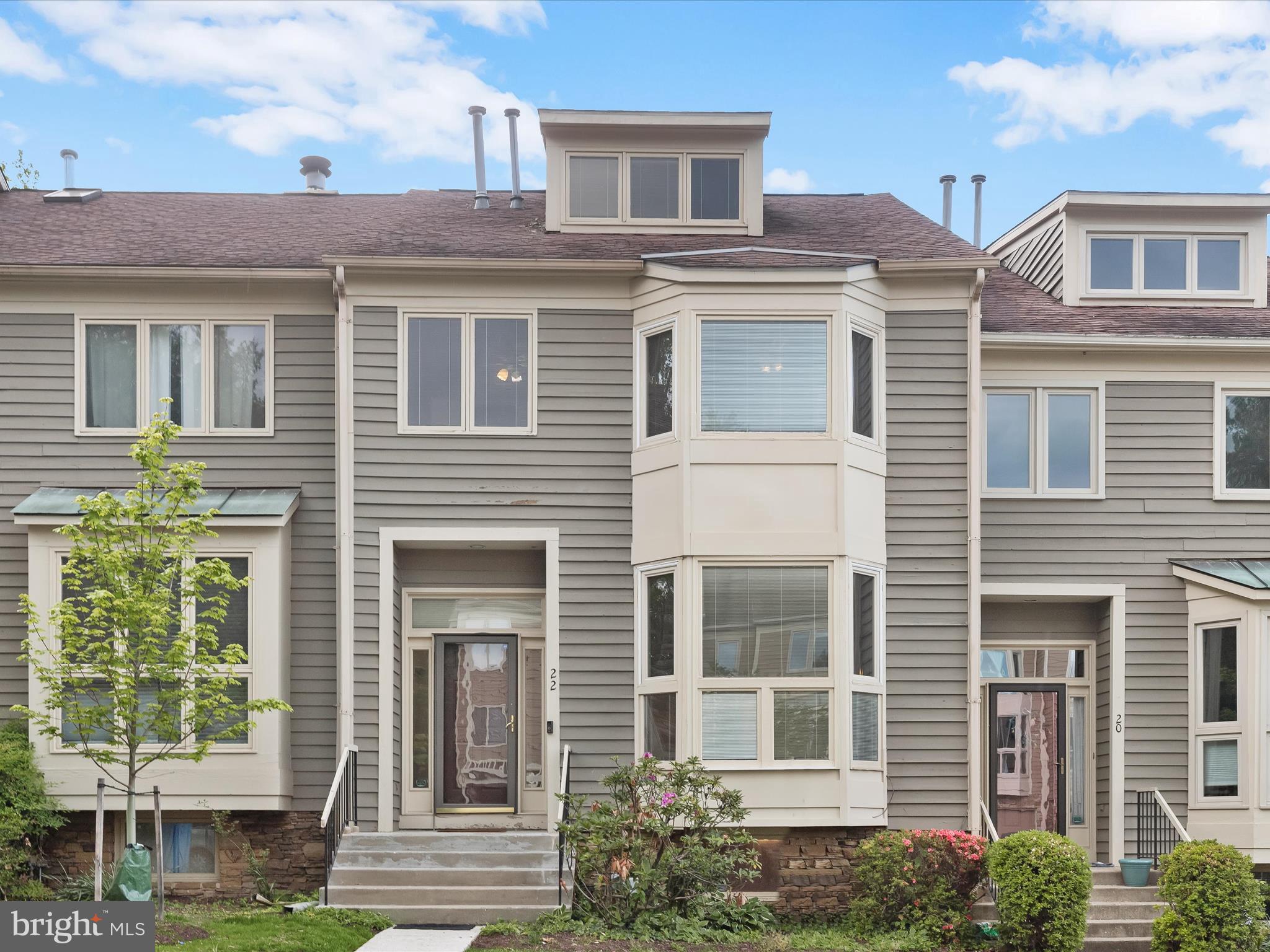 **OFFER DEADLINE: MONDAU May 12th at 12:00pm** Welcome home to this four bedroom, three full and one half bathroom townhome tucked away in the highly sought-after Summit Chase neighborhood. Inside, the eat-in kitchen features stainless steel appliances, granite countertops, a pantry, recessed lighting, and a breakfast nook with a bay window. Hardwood floors and high ceilings create an open, inviting atmosphere throughout the main level. The living and dining rooms flow together in an open-concept layout accented by crown molding and access to the rear deck. A convenient half bathroom finishes this level. Upstairs, the primary bedroom suite impresses with a soaring vaulted ceiling and a private loft that is ideal for a home office or lounge. The updated en-suite bathroom showcases a beautiful walk-in shower, dual vanity, and a vaulted ceiling with skylight. Multiple closets, including a walk-in, complete the suite. Two additional bedrooms upstairs share a second full bathroom with a tub-shower and dual-sink vanity. Downstairs, the finished lower level provides additional living space with a family room that features a cozy wood-burning fireplace, a wet bar, and walk-out access to the patio. The fourth bedroom has an adjacent full bathroom, offering additional privacy. Rounding out the lower level is a laundry room and storage. Enjoy the Summit Chase community amenities, including an outdoor pool with a separate kiddie pool, tennis and pickleball courts, and a clubhouse. Located in a fantastic location with quick access to I-695 and I-83, you will find everything you need just around the corner. Some images have been virtually staged.