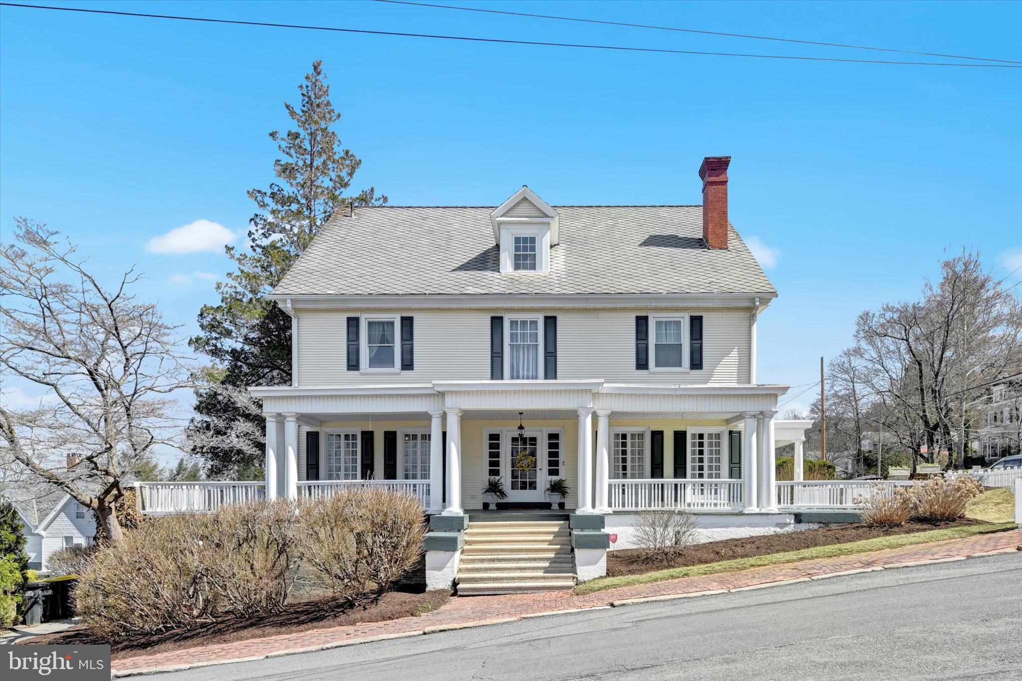 Welcome home to this remarkable home on Howard Avenue!  The owners have made many upgrades while preserving many of the historic features of this home.  Beautiful hardwood flooring adorns most of the home while a few rooms have tile flooring.  The first floor features a living room with lots of natural lighting and leads to an office or den and a powder room.  The large family room features 2 fireplaces and leads to the large wrap around porch.  The formal dining room highlights a window seat and the original servants bell is still in the floor in working condition.  The large butlers pantry leads to the 24 handle eat in kitchen.  You can get to the second floor from the old stairs in the kitchen. In the warmer months enjoy the screened in sunroom off the kitchen.  Going to the second floor you can't help but stop at the window seat and enjoy the view.  The second floor features the primary bedroom with 2 closets and a primary bath with tile and a walk in shower.  The 3 other bedrooms all have closets and ceiling fans.  There is a sitting room that could be turned into a bedroom, large walk in closet, den or office.    Another full bath and a large laundry room complete the second floor.   The third floor features 2 bonus rooms; one currently is set up as an exercise room and the other as a bedroom.  So many possibilities for these 2 rooms.  There are 2 storage rooms as well.  Both these storage rooms have drawings on them that the current owners never painted over because they are the art work of Artist Lewis Auchenbach when he was a child.  Large basement for storage.  Relax on the large wrap around porch.  Level back yard.  Brand new hot water heater.
