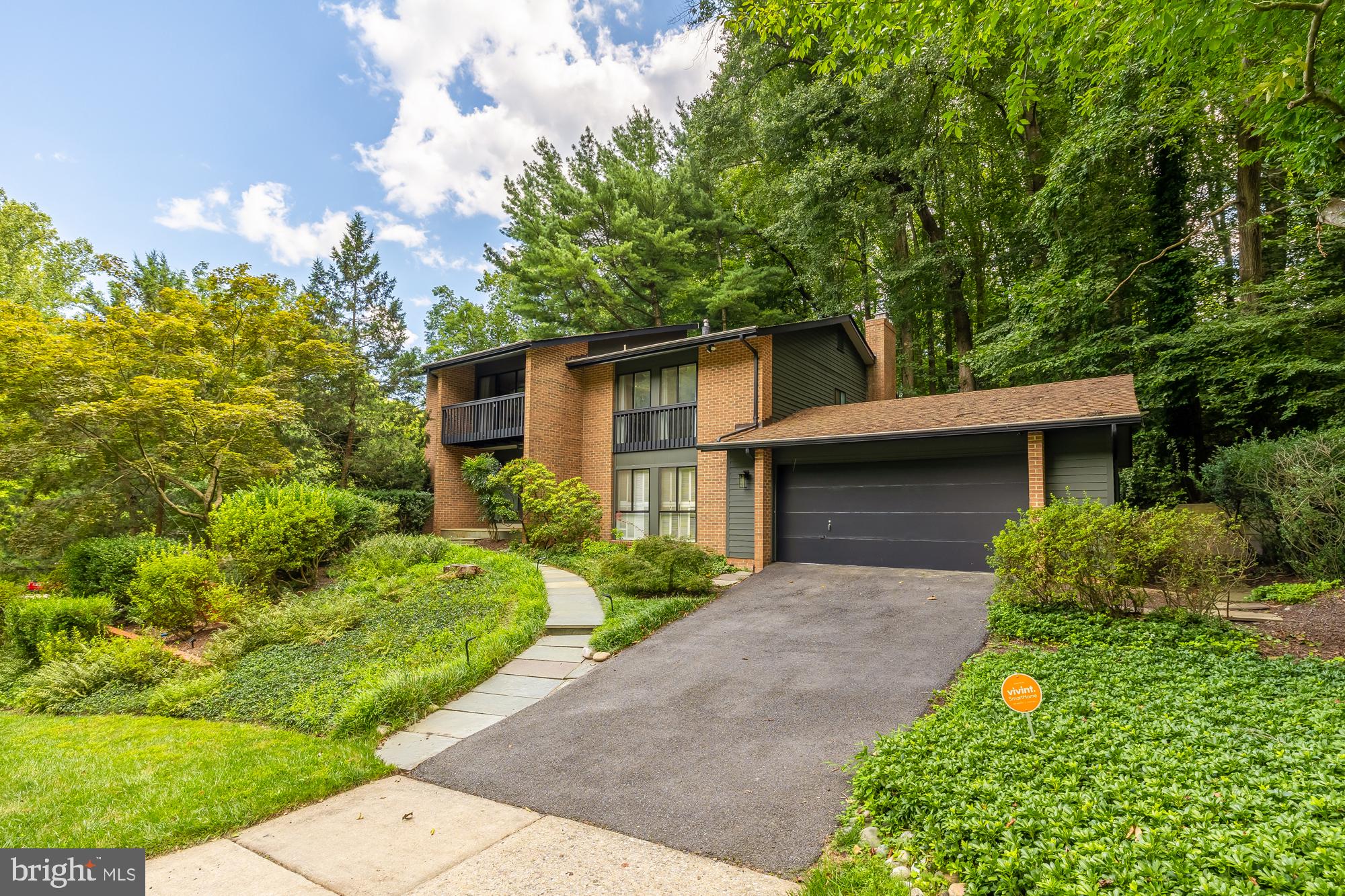 Welcome to 6808 Carlynn Court, a modern masterpiece nestled in the peaceful enclave of Bethesda, MD. This exceptional home offers 5 bedrooms, 4 bathrooms, and an expansive 4,678 square feet of living space on a generous nearly 15,000 square foot lot.

As you enter, you'll immediately notice the beautifully painted interiors and exteriors that give the home a fresh, contemporary feel. The hardwood floors extend throughout the space, and the two-story living room boasts large windows that flood the area with natural light, creating an airy and inviting atmosphere. The vaulted ceilings enhance the sense of openness, while the formal dining room provides an elegant space for entertaining and special gatherings.

The updated kitchen features modern cabinets and ample space, ideal for all your culinary needs. Recent electrical and plumbing updates throughout the home ensure both convenience and efficiency. The bathrooms have all been thoughtfully renovated, adding a touch of luxury and modern comfort. A charming wood-burning fireplace in the living area adds a cozy touch for relaxing evenings. The primary suite is a serene retreat nestled among the treetops, complete with picturesque views, a walk-in closet, and a luxurious spa-like ensuite bathroom.

Additional highlights include a full basement, an attached garage, and a patio deck that has been recently refinished for outdoor enjoyment. An EV charger is also thoughtfully included, catering to eco-conscious residents.

Located just moments away from the Potomac River, in the desirable Cabin John neighborhood with excellent schools and parks, this home offers a perfect blend of modern luxury and tranquility. Don’t miss the opportunity to make this exquisitely updated property your own.