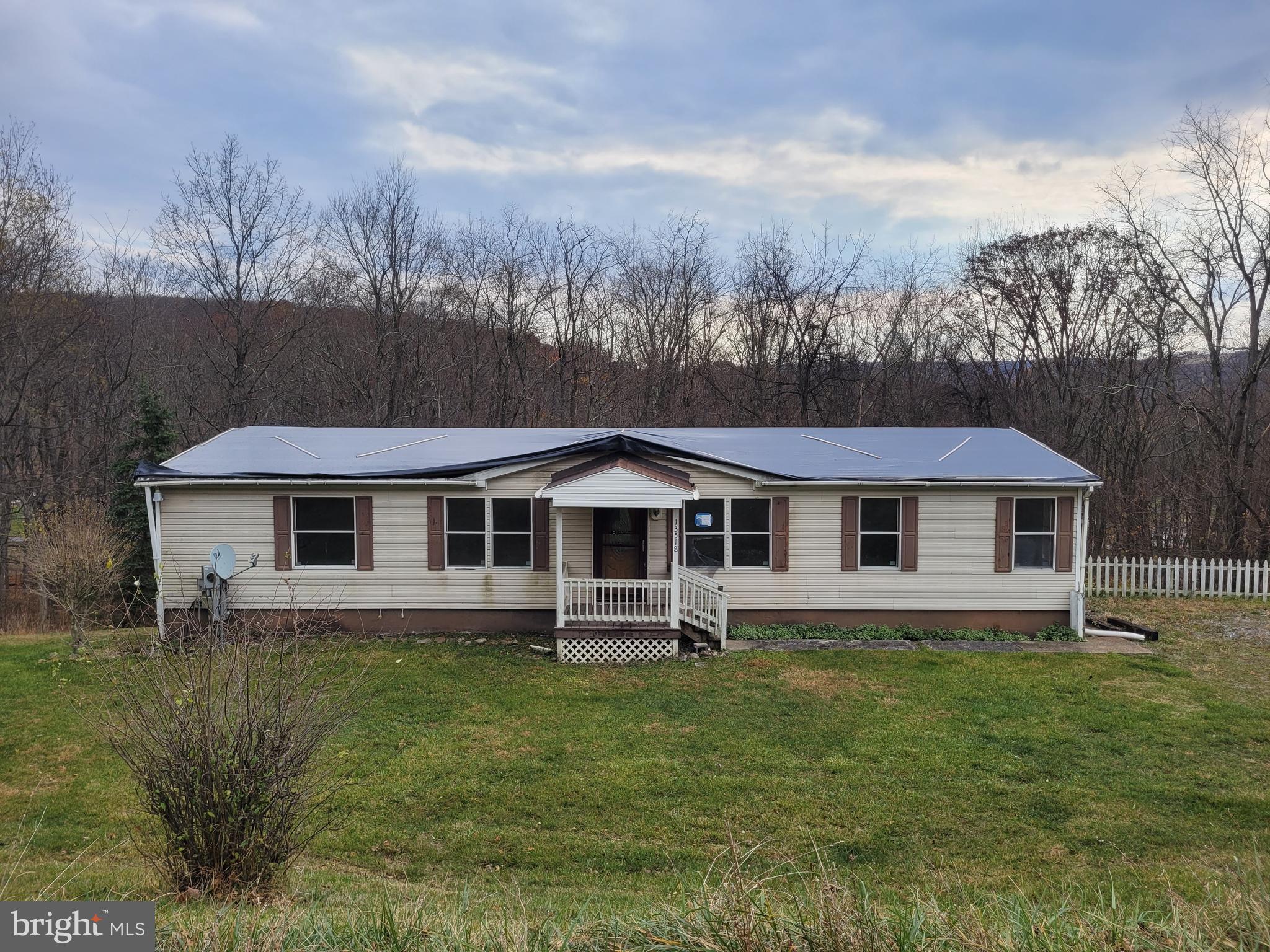 Discover this ranch-style manufactured home, nestled on a spacious 1.1-acre lot. Enjoy stunning mountain views that provide a serene backdrop for your daily life. The full basement offers ample storage or potential for additional living space, while off-street parking ensures convenience for you and your guests.  This property combines the tranquility of rural living with easy access to nearby amenities, making it an ideal choice for those seeking a peaceful retreat. Don't miss the opportunity to make this your own!