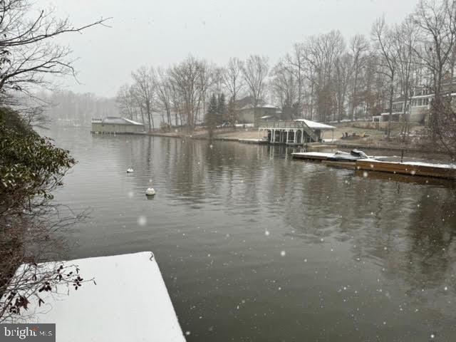 Even though it's cold outside and January brought snow, you can get ready for summer fun here! Waterfront lot located on Contrary Creek on the public side of the lake with 50 feet of shoreline and a dock/sundeck already in place. Beautiful cul-de-sac location offers privacy and great views! Soil work on file for a 3 bedroom drain field. Bring your builder, your dream home plans and build on this 1.03 acre lot at Lake Anna, VA before it's gone!  Priced below current county assessment!