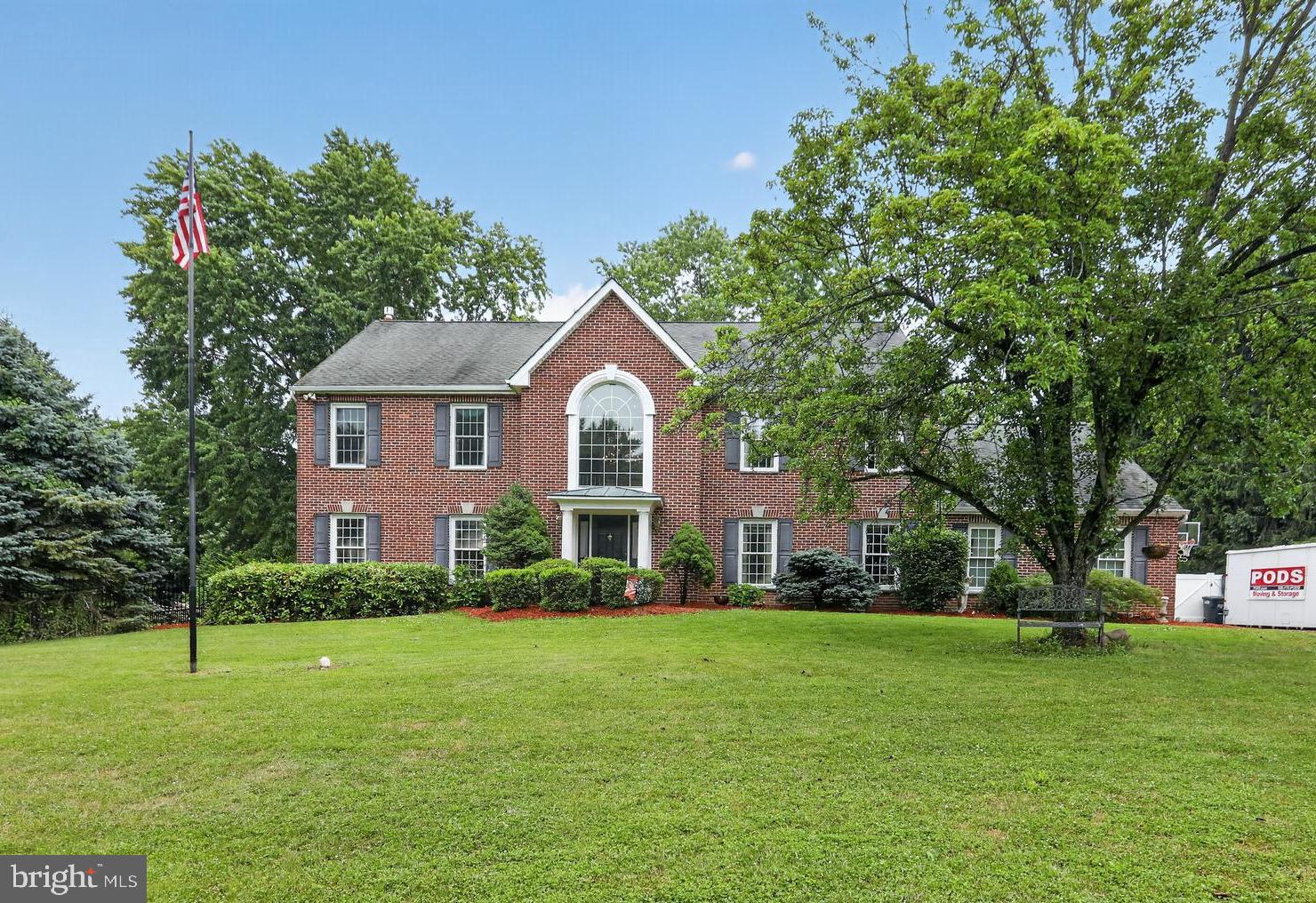 Rarely offered, this stately Georgian Colonial is perfectly situated on a private cul-de-sac and set on over an acre of beautifully landscaped grounds, offering modern updates including Newer water heater, newer A/C , newer enclosed back screened deck for year round comfort and an exceptional indoor-outdoor lifestyle. The impressive brick exterior and custom finishes create a warm welcome. Step inside the sun-drenched two-story foyer, where a dramatic Palladian window fills the space with natural light and showcases the stunning wide-plank cherry hardwood flooring. The center hall flows seamlessly into a spacious formal living room and large dining room the perfect setting for everyday living and memorable entertaining. The beautifully appointed gourmet kitchen features custom cabinetry, granite countertops, and thoughtfully selected finishes. The sunny breakfast area overlooks the  backyard oasis and opens to the inviting family room, offering a warm and comfortable  space for family and friends. The main level also includes a spacious laundry room, an updated powder room, and a convenient tiled shower, adding both functionality and flexibility. Upstairs, the primary suite is a true restful retreat and has a  separate sitting room -  a perfect space for a home office, nursery, reading room, or fitness area. The en-suite spa-inspired  bath offers a serene escape with luxurious finishes designed for ultimate comfort. Three additional generously sized bedrooms and a beautifully renovated full bath complete the second floor. From the family room, step into the expansive enclosed porch, where peaceful views of the private backyard -  perfect place to relax in every season. Outside, the resort-style setting continues with a sparkling in-ground saltwater heated pool featuring a newer concrete liner, a large covered patio for outdoor dining and entertaining, and a charming gazebo that provides welcome shade on sunny afternoons. Additional highlights include a side-entry two-car garage, an oversized driveway with extra parking, and professionally designed landscaping with mature trees and lush gardens that provide year-round beauty and privacy. This remarkable property offers the perfect combination of classic Georgian architecture, luxury updates, generous living spaces, and an extraordinary outdoor oasis—all in a highly desirable location easy shopping, dining and the best parks nearby.