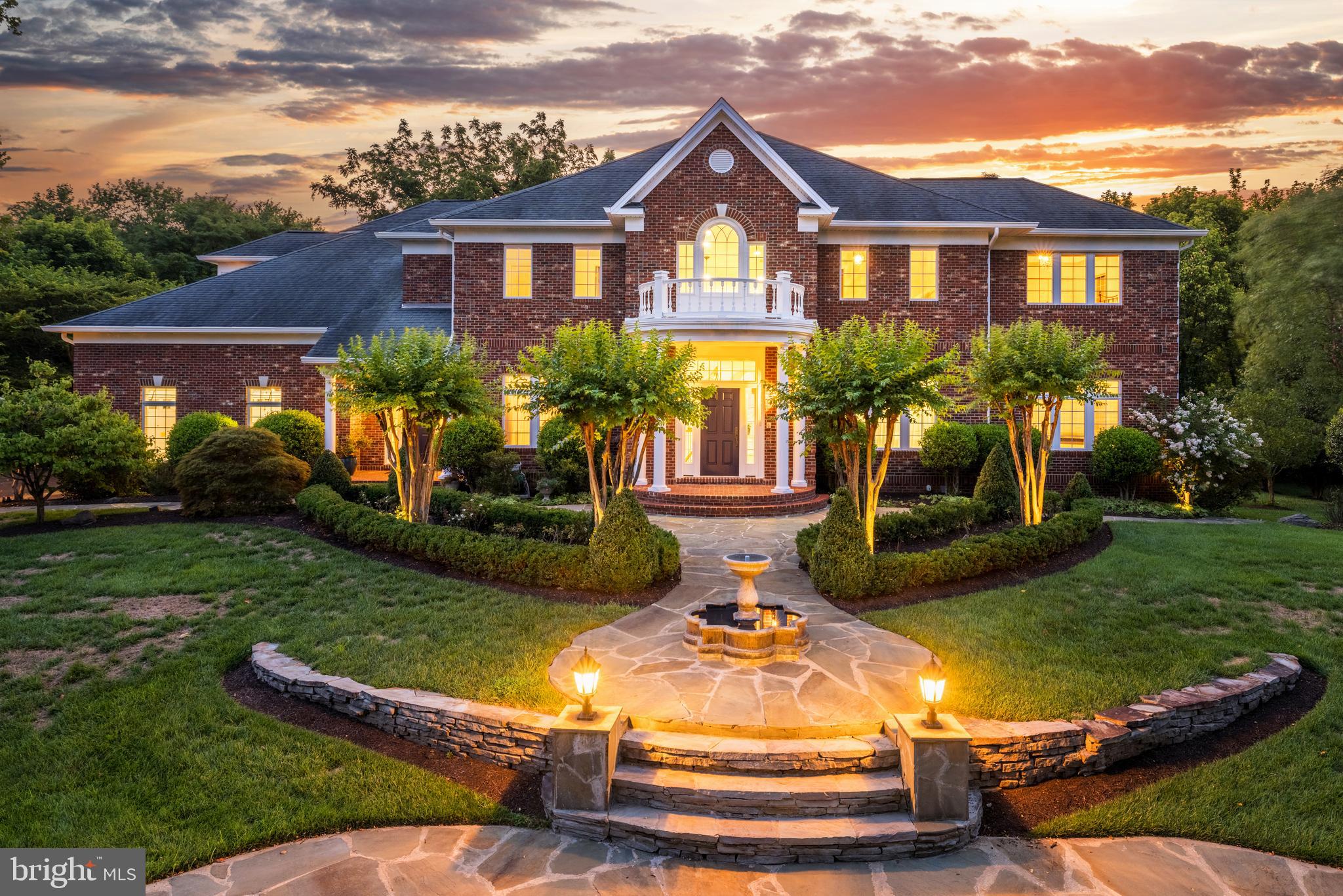 Discover this private enclave and bucolic oasis of tranquility. Nestled in a serene, park-like setting with lush green views, this estate combines peaceful seclusion with prime convenience. Located close to the GW Parkway, it offers quick access to D.C., Reagan National Airport, downtown McLean shopping, and the Tysons Metro Stations.

The classic exterior, crafted from Chicago-style brick with coin corners and keystone details, enhances the home's welcoming curb appeal. Inside, nearly 7,000 square feet of freshly painted living space showcase timeless grandeur, with spacious rooms, six bedrooms, and eight bathrooms. Each private balcony overlooks the picturesque landscape, adding to the estate’s elegance.

The expansive rear yard, featuring mature landscaping, provides privacy and serenity—perfect for relaxation or outdoor activities. With a full and half bath on the main level, the sunroom offers the flexibility to convert into a main-level bedroom if desired. The walk-out lower level provides easy access to the grounds, and the property is spacious enough to accommodate a pool, offering endless possibilities for customization and enjoyment.