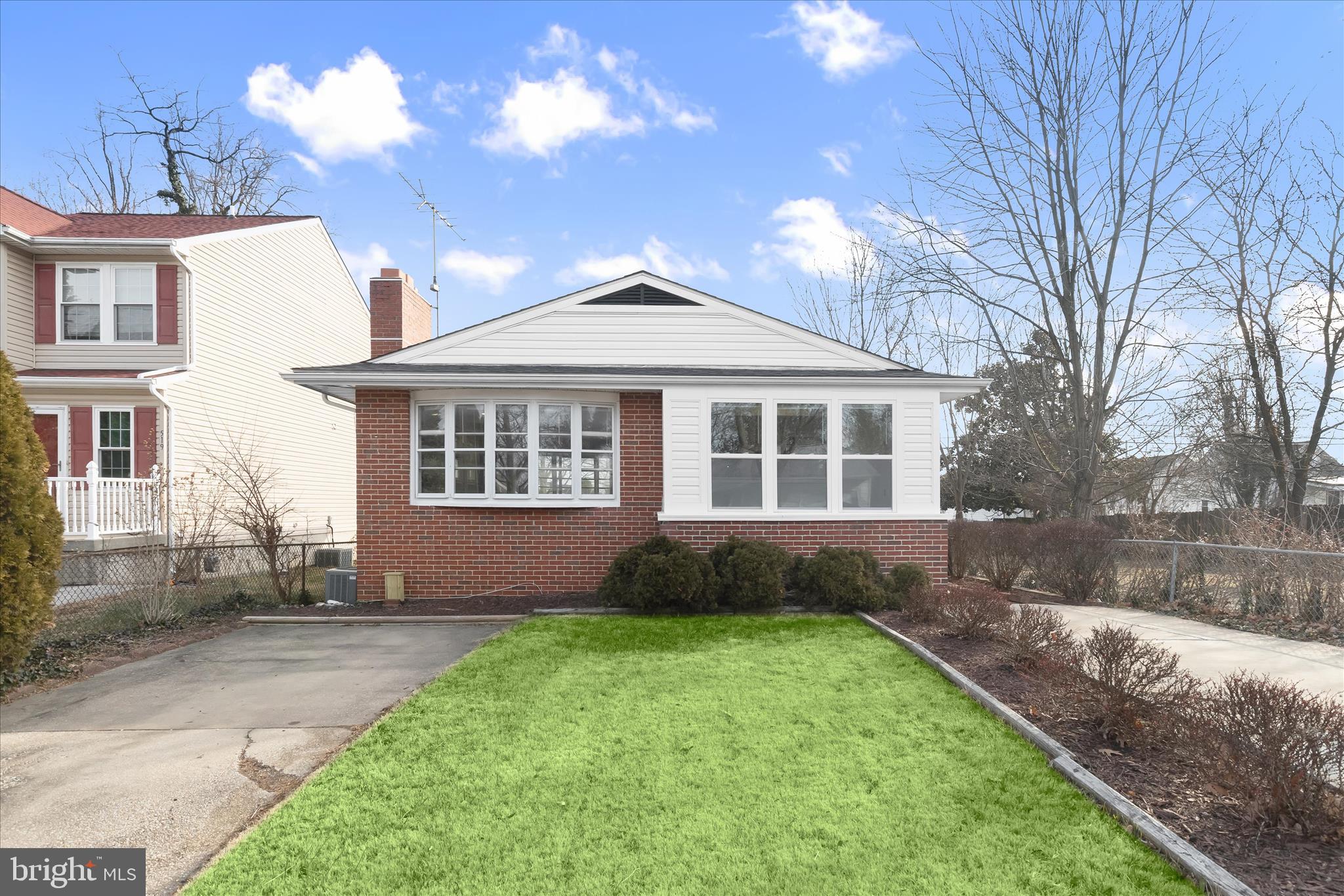 Welcome to this beautifully updated two-level rancher in one of Catonsville’s most vibrant communities! This home radiates charm, starting with an airy open floor plan where a cozy wood-burning stove and a large picture window create an inviting atmosphere. The kitchen features warm wood cabinetry, sleek black countertops, and a custom tile backsplash, while three comfortable bedrooms and a refreshed full bath complete the main level.
The finished lower level significantly expands your living space, offering a family room with a stylish accent wall, bonus rooms perfect for home offices or guests, a second full bath, and dedicated storage. Outside, the fully fenced backyard features a unique detached sunroom for year-round enjoyment, plus the convenience of a two-car driveway. Ideally located near major commuter routes, shopping, and dining, this home offers the perfect mix of comfort and accessibility.