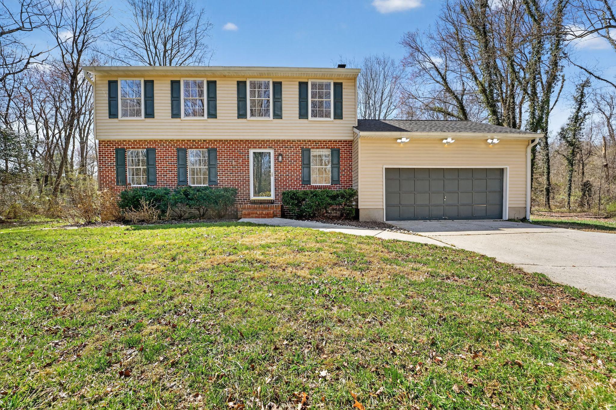 Roll down your own private, tree-lined lane to this beautifully refreshed colonial, nestled in a sunny clearing on a full, flat acre surrounded by mature trees. Ideally located midway between Annapolis and Baltimore — and just minutes from Fort Meade and the NSA — Millersville offers exceptional commuter access to the cities at the intersection of I-97 and State Rd. 32.

Inside, the updated kitchen features stone countertops and stainless appliances and flows directly into a cozy family room with a wood-burning fireplace. A huge screened porch off the family room, that then leads to an outdoor BBQ deck, extends your living space through every season. Four large bedrooms upstairs. Fully finished basement with its own separate exit to the backyard — flexible space for whatever you need.

One private lane. One sunny acre. Surrounded by trees. Right in the middle of everything.  And a cute tractor.