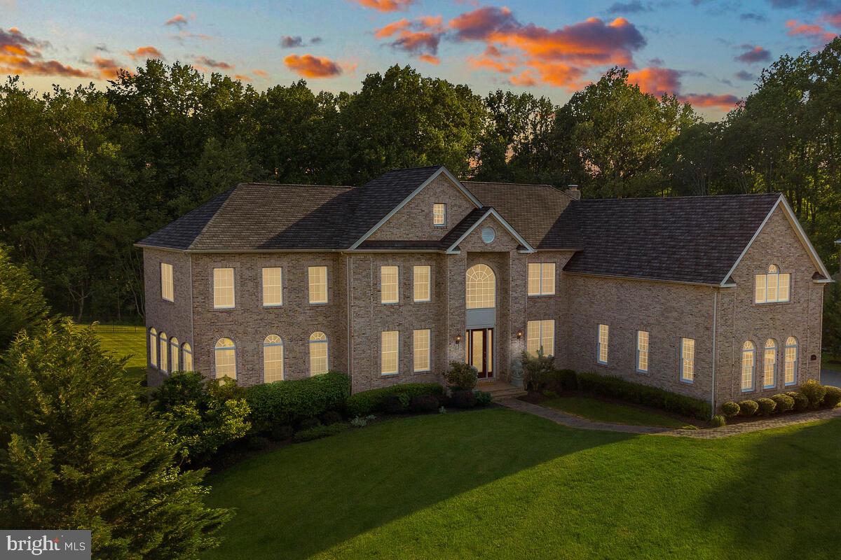 Open House Cancelled! Impressive Southport Heritage model by Toll Brothers in the prestigious Patuxent Chase community! This magnificent home is situated at the end of a picturesque cul-de-sac street on a premium 1.12 acre lot surrounded by scenic woodlands. Luxurious with lots of outstanding features: 10’ ceiling on main level, 9’ ceiling on basement and upper levels; Grand 8’ beveled glass front entry door; 3-car side-entry fully drywalled garage w/additional storage space; All-brick exterior with architectural detailing; Quality Anderson windows with high-performance glass; High-efficiency 3-zone heat and central AC; Efficient R-38 ceiling insulation; 75-gallon hot water heater; Dramatic 2-story foyer featuring a curved staircase with iron balusters; Gleaming hardwood floors, elegant oversized crown molding & beautiful wainscotting throughout entire main level; Private first floor study with full wall bookcase cabinetry; Beautiful formal living room with crystal chandelier; Grand Conservatory addition adjoining the formal living room; Elegant formal dining room w/ modern chandelier; Magnificent chef’s kitchen featuring beautifully crafted 42” cherry cabinets; Stainless steel GE Monogram appliances including double wall ovens, gas cooktop, frost-free 42” refrigerator, and vent-out range hood; Spacious granite countertops; Breakfast area adjacent to kitchen and large center island; Morning room addition off the kitchen in the back with vaulted ceiling; Spacious 2-story family room boasting masonry fireplace with raised stone hearth and mantel, Classic crystal chandelier with motorized lift system, Wall of windows w/views of the scenic and picturesque yard that backs to preservation land, and rear staircase leading to upstairs; Fully equipped 2nd kitchen (catering kitchen) next to laundry room; Beautifully updated powder room. Upper level featuring 4 spacious bedrooms with 4 en-suite bathrooms, plus and a enormous playroom/hobby room above the grand conservatory addition; Master bedroom featuring a sitting room, decorative columns, crown molding, 4 large walk-in closets & a dressing area; Luxurious master bathroom comes with 6’ whirlpool tub, separate shower, and dual vanities. Fully finished daylight walk-out basement with 4 full-sized windows & a large patio door; expansive recreational room with fully equipped wet bar; a very spacious executive office with large windows; 6th bedroom and 5th full bathroom; plus lots of storage space. Large french doors from the family room, morning room, and basement extend the indoor living space to wonderful outdoor living spaces: Gorgeous 1.12 acre lot with great views (partially fenced-in); large pavement patios; screened gazebo; side garden with stone retaining wall. Enjoy a relaxed atmosphere of country living with a prime/convenient location: Down the road from River Hill shopping center, 5 minutes from Hobbits Glen Golf Course, 5-10 minutes from Columbia Association fitness clubs, 10 minutes from Centennial Park and Wilde Lake park, less than 10 minutes away from Columbia Mall, and easy access to Rt 32, I-95, and other commuter routes.  You’ll also be a short ride away from historic Ellicott City boutique stores, less than 20 minutes from BWI, less than 30 minutes from Baltimore, and less than 40 minutes from Washington DC. Don’t miss this exceptional opportunity!