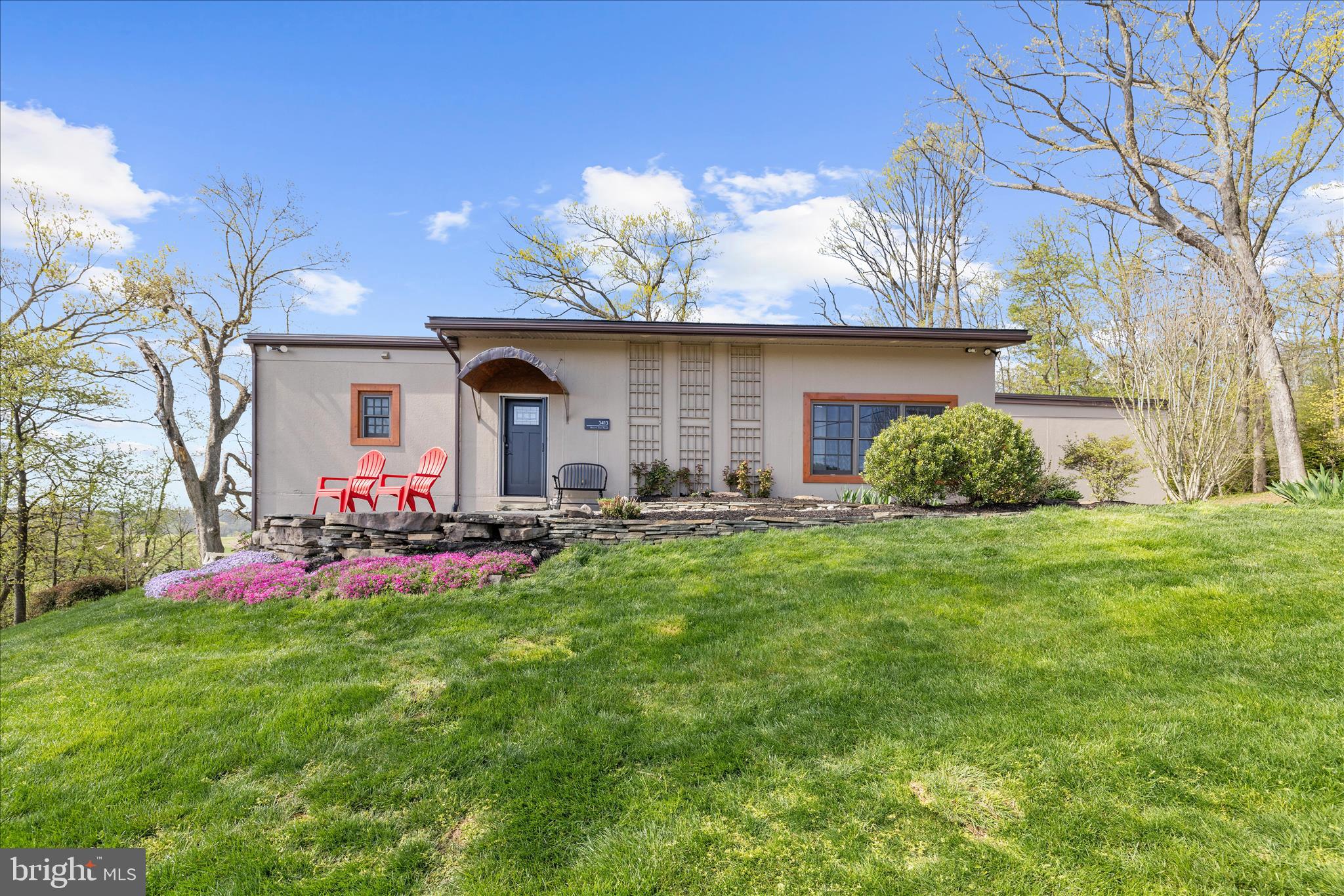 You will want to see this property its Gorgeous !!  (the entire meadow and into the woods is part of the property) Welcome to this extraordinary custom-built home nestled in the serene countryside of Baltimore County—where privacy, lifestyle, and convenience come together seamlessly. Offering 4 bedrooms, 2.5 bathrooms, and a thoughtfully designed layout, this home delivers both everyday comfort and exceptional entertaining.

Step inside to a true open-concept main level featuring soaring ceilings, transom windows, and rich oak hardwood flooring. Natural light pours into the living, dining, and kitchen spaces, creating a warm and inviting atmosphere. The kitchen is beautifully appointed with granite countertops, induction cooktop with exhaust hood, wall oven, tile flooring, and a spacious island with built-in microwave.

Designed for effortless one-level living, the main floor also includes a large home office with radiant heated floors, laundry room, and an expansive primary suite. The primary retreat offers dual walk-in closets and a spa-inspired bath, along with direct access to a stunning screened-in porch, french doors—perfect for enjoying peaceful countryside views.

The fully finished lower level expands your living space with three additional bedrooms, a full bath, a den with radiant flooring, and a large recreation area previously used as a basketball gym. This flexible space also includes a storage area with potential for garage conversion. French doors lead to a beautifully designed patio, creating seamless indoor-outdoor flow.

Outdoor living is where this home truly shines. Enjoy multiple spaces to relax and entertain—from the screened porch to the lower patio and firepit area. A private field just beyond the home offers endless possibilities for recreation, gatherings, or simply enjoying the surrounding nature. Extensive landscaping enhancements, stone walkways, flowering trees, and curated gardens elevate the property’s charm, while a fenced organic garden and fruit trees provide a true farm-to-table lifestyle.

The home is equipped with a highly efficient geothermal heating and cooling system, radiant heated floors, a mini-split system, advanced BAT septic system, and a whole-house Generac Home Generator for peace of mind.

Perfectly positioned, this property offers the tranquility of country living while remaining just 15–20 minutes to Hunt Valley and 25 minutes to Greenspring Station, with easy access to major routes including I-83, 695, and beyond. Perfect location for urban living where you can also have horses and various other animals on this beautiful property. 

Surrounded by protected countryside views, vibrant nature, and a welcoming community—including the charm of local horse and hound traditions—this one-of-a-kind home offers a lifestyle that is truly unmatched.