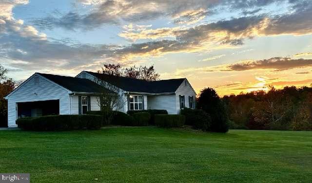 Location, Location! This home sits on almost 5 acres with a Warrenton address but it is located in Culpeper County. Want to watch the gorgeous sunsets over the Blue Ridge Mountains every night? Or take a day trip to Skyline Drive and Luray Caverns without having to drive too far? This is the home for you! 
This spacious home offers 2 living spaces or a nice in-law-suite.  The main level has a wonderful kitchen with Granite counter tops, built in bookcases, and a large eating area. The Washer & Dryer is placed in the garage, right off of the kitchen for convenience. A beautiful living room with a gas fireplace with, sunroom, and new Trex deck off the living room/ dining room. Sunroom is wonderful for using all year around and for extra space during the Holiday's. 
Main Level has 3 nice size bedrooms with 2 full baths. Master bedroom has 2 closets, and one is a nice walk in closet.  Full basement has a side walkout entrance with large rec room with lots of light, full bathroom, bedroom, and a large storage room with another washer and dryer.  Beautiful yard for all of your animals and activities, with 2 nice size sheds and also a run-in shed.  NO HOA! Come see this house and you will fall in love with everything it has to offer and you're only 8 miles from the bustling town of Warrenton.