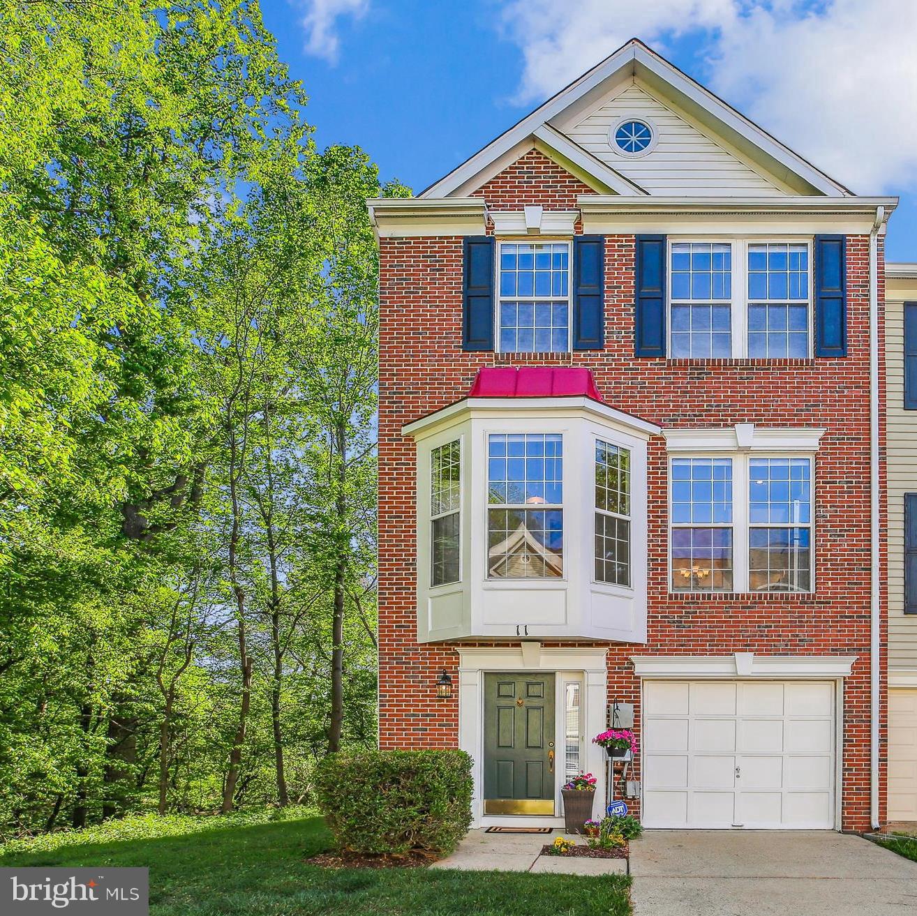 WOW! This stunning end-unit townhome feels like new with recent renovations and modern updates throughout. Featuring three finished levels and an attached garage, it is beautifully surrounded by trees with outdoor spaces accessible from both the lower and main levels.
The main level boasts high ceilings and abundant natural light from numerous windows and sliding doors leading to a private deck. The completely renovated kitchen features stainless steel appliances, 42-inch white cabinets, upgraded granite countertops, a pantry, and a wall of windows. It overlooks the dining room, perfect for easy entertaining.  There is also a breakfast nook in the kitchen for informal dining.
The spacious family room offers a cozy gas fireplace flanked by two windows and direct access to the deck. Gorgeous hardwood floors span the main living area and both staircases. A convenient half bath completes this level.
Upstairs, new carpeting extends throughout the bedrooms. The primary bedroom includes two closets and a beautifully renovated en suite bathroom with modern updates. There are 2 additional bedrooms on this level and an updated hall bathroom.
The lower level, with direct garage access, features a den that opens to a private back area. This level also includes a hall closet, a half bath, and a full-sized washer and dryer.
Recessed lighting brightens all three levels, and a brand-new roof was installed in 2025.
Set against a backdrop of trees and common grounds, this gorgeous townhome offers a peaceful retreat within the Cloverleaf community. Lastly, enjoy easy access to I-270 and nearby shops and restaurants.  You won't want to miss this townhome!