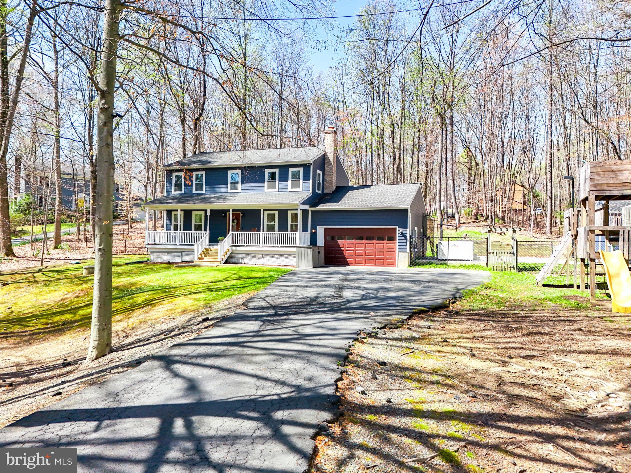 Nestled on a wooded, 1.06 acre lot, this stunning home is a fusion of modern elegance and smart technology. The inviting, country porch welcomes you in to a bright, main level with hardwood flooring and recessed lights.The kitchen is a chef's dream, boasting a cast-iron sink, stainless steel appliances, quartz countertops, a convenient pot-filler, a coffee nook, and plenty of counter and cabinet space. Separate, formal dining room and spacious family room. The laundry and mudroom is equipped with custom cabinetry providing abundant storage with quartz countertops, and heated floors for added comfort. The living room's wood stove makes it a cozy space, right off the kitchen. Updated powder room. Upstairs, find three sizable bedrooms and two updated baths. The primary bedroom has a walk-in closet and the bathroom is a retreat in itself, boasting heated floors, a soaking tub, and a spacious glass shower. On the lower level, find a finished, rec room/den and a space that is perfect for a home office with a built-in, wall to wall desk. The basement has plenty of storage and closet space. For those who value sustainability and technology, this smart house is equipped with Haiku smart fans that sync to the HVAC system, a whole house generator, an exterior ubiquiti unifi camera system, and is ready for an EV charger. The outdoor space promises endless enjoyment with its large sunroom to take in nature, the durable Trex deck, a saltwater hot tub with a fountain and lights, a large patio with basketball court, and a Trex playground. This impressive home blends classic charm and cutting-edge amenities. 2 car garage and roomy storage shed with Hardiplank siding to match. Kitchen Reno 2025. Fresh Paint 2025. Primary Bath Reno 2023. Tankless Water Heater 2020. Powder Room reno 2022. New Garage Door 2024. New windows 2019. Hardiplank Siding 2019. Roof 2017. HVAC dual zone 2017. Whole House Generator 2024. Laundry/Mud Room Reno 2022. Quick commuter convenience with easy access to 95, Lake Ridge shops and restaurants, and public transit. Close to charming, Downtown Clifton. No HOA.