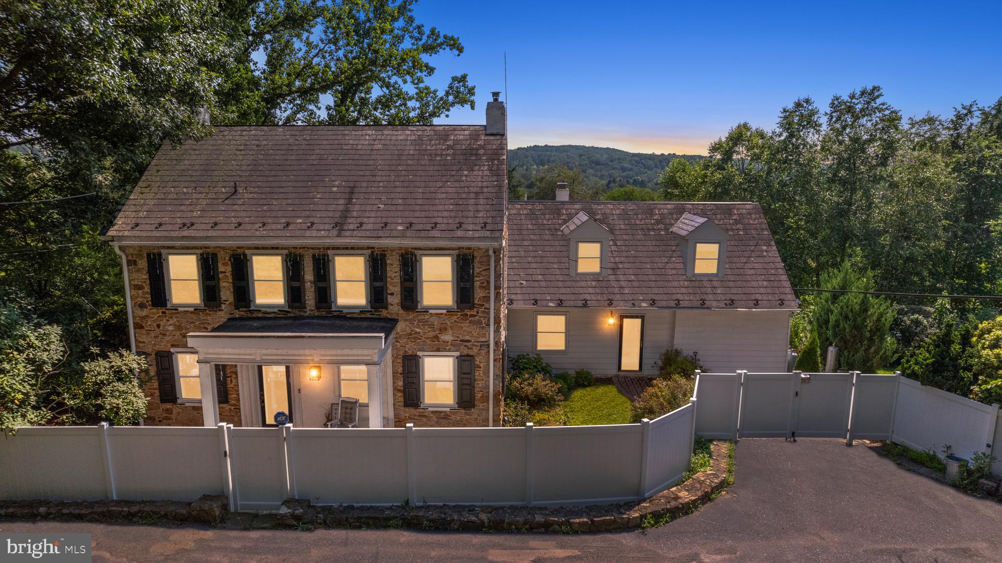 Peaceful tranquility, unparalleled privacy, history, year-round bucolic views & future Bed & Breakfast potential abound at Stone Pond Farm! This 6 Bed 7.5 Bath 3400SQFT classic stone farmhouse w/gardens, in-ground pool, spring fed pond & original stone bank barn proudly overlooking 100’s acres of preserved farmland w/views of Lake Nockamixon & Haycock Mountain embodies the Bucks County lifestyle while invoking images of the properties rich history dating back to the days of William Penn’s family & the 1st owner of the land, William Cook in 1763! Exterior accents include handcrafted stone walls & slate patios & 2 trex decks to enjoy all the natural beauty this picturesque paradise has to offer!  Inside, charming wide plank pumpkin pine floors, 18” windowsills & original millwork showcase the craftsmanship! Large family/gathering room w/classic fireplace/woodstove. Sun-soaked dining room w/sliding door leading to large deck, bright living room w/floor to ceiling windows, view of the grounds & access to bluestone patio, deck & driveway. Commercial kitchen! Very large 1st floor master bedroom w/ private deck & ensuite master bath! Spacious upper master bedroom! Additional 5 bedrooms & 5.5 Baths! There is an abundance of space for family or guests! Walk out basement w/living area, office, bedroom & full bath, generous storage areas & rear storage garage. sprawling 3.6 Acre lush green grounds w/recently renovated inground pool, spring fed pond, bountiful flower & vegetable gardens! An original 3 story stone “bank barn” w/Full Bath & 2 entertainment areas, this highly versatile adaptable space can be used for entertaining family & guests / weddings/ art/music/ photography studios/ woodworking shop. The 1st floor of the barn is large w/ground level basement for storage! There is plenty of parking for 12+ cars in the gated driveway! The parking area could easily accommodate large RV’s or boats! Recent upgrades include new front fence & motorized gate w/keypad entry & whole house Evoke 23,028-watt solar system! Current owner has approval for Bed & Breakfast from Springfield Township issued 5/23. Located 17 minutes from Route 78, 25 minutes from Doylestown & 35 minutes from New Hope! This is a rare & unique opportunity to own piece of history dating back to the days of William Penn’s family & the 1st owner own the land William Cook, in 1763! This 6 Bed 7.5 Bath 3400SQFT classic stone farmhouse w/sprawling 3.6-acre lush green grounds/gardens/ in ground pool/ spring fed pond & original stone bank barn w/ bucolic Bucks County views proudly overlooking 100’s acres of preserved farmland w/views of Lake Nockamixon & Haycock Mountain w/future Bed & Breakfast, potential deserves a reservation at the top of your must see list!