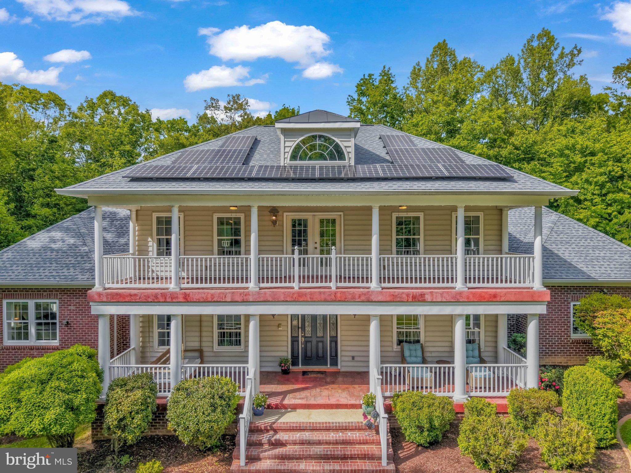 **Ask about the assumable 3.25% VA interest rate!    Experience resort style living on 10 private, wooded acres in sought after Kings Grant, an equestrian community known for its community barn and miles of serene wooded streams and riding trails.  This beautifully sited home sits deep on the lot for maximum privacy and tranquility, surrounded by nature, with calm, peaceful views from every window.  Solidly built with insulated concrete form (ICF) construction, the home combines energy efficiency, durability, and remarkable updates with approximately $175,000 in incredible upgrades throughout.
The main level is designed for both everyday living and entertaining, with a dramatic two story family room and open dining area, soaring ceilings, balcony overlooks, and extensive built ins and woodwork that add both character and storage.  A standout feature is the flexibility of two bedroom suites on the main level, including a massive primary suite for true main level living.  A true gourmet kitchen with updated appliances is complimented by the magnificent walk in pantry that can handle all your storage needs, additional prep space away from guests, bar for entertaining, or delightful coffee bar.  Just off the garage, a mudroom keeps boots, coats, and gear neatly tucked away, right by the main level laundry.
Outdoor living is a highlight: choose from four separate balconies or the rear deck, each offering a different vantage point over the pool and wooded backdrop.  It’s an ideal setup for morning coffee, quiet evenings, or hosting friends and family by the pool (2022).
The lower level feels like its own retreat, featuring a theater room, stunning dedicated office, bright bedroom with full bath, large recreation room, an impressive gym, and various extensive storage rooms. Whether you work from home, need flexible guest space, or want a serious home gym and media area, this level is already perfectly set up - with more custom built ins for organization and display.
Comfort and efficiency are built in at every turn: radiant heated flooring throughout the home, a pellet stove with custom stonework for cozy supplemental heat, a solar panel system (installed 2022) to help curb monthly utility costs, and a whole home generator (2022) for peace of mind during any outage. Modern flooring upgrades, an updated kitchen and pantry, three renovated office/flex spaces, a Tesla charger, a 50-amp RV hookup, hard wired ethernet to every room (2025), and beautiful built ins on multiple levels complete the package.
All of this in Kings Grant, where large acreage homes, equestrian amenities, and miles of private trails create a rare blend of privacy, community, and outdoor lifestyle - yet you are still within convenient reach of Fredericksburg, major commuter routes, and shopping.
**An exceptional value opportunity: 3.25% assumable VA loan may be available to qualified buyers, subject to lender approval and eligibility.