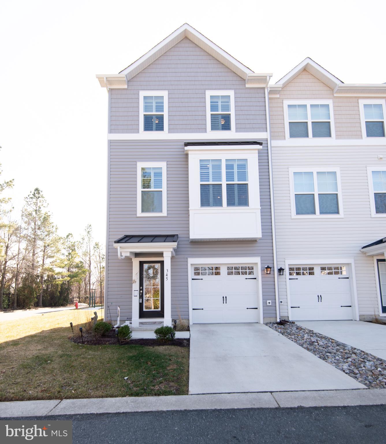 ***MOTIVATED SELLER***Better Than New!  - This meticulously crafted and maintained End Unit Townhome, just six months old, boasts thoughtfully chosen upgrades throughout its entirety. The Hunter Douglas Plantation Shutters and elegant window treatments are included, adding a touch of sophistication. Featuring an open floor plan and luxury vinyl plank flooring, this unit is truly exceptional. With a 10-foot extension on all three levels and 9' ceiling height on the 1st and 2nd floors, this home offers remarkable spaciousness and enhanced functionality.

The main living area presents a center island kitchen with a breakfast bar, pendant lighting, LED recessed lights, stainless steel appliances, upgraded cabinetry, a ceramic tile backsplash, Quartz countertops, a stainless steel farm sink with upgraded faucets, and so much more. This level also includes a breakfast area and a double-door pantry, providing ample storage space. The Great Room is generously sized and impeccably designed, featuring the 10-foot extension that allows for additional seating areas. Natural light floods the room through a sliding glass door that leads to the balcony. A convenient powder room completes this floor.

The upper level is home to a well-designed and functional Primary Suite, spacious enough to accommodate a king-sized bed, nightstands, and dressers. The attached bathroom features a dual vanity, a walk-in ceramic tile shower, a separate toilet room, and a walk-in closet. This level also houses two additional bedrooms, a full bathroom, and laundry facilities.

The lower level entrance is beautifully appointed with gleaming luxury vinyl plank flooring, providing the perfect space to hang jackets and put on shoes. The recreation room on this level offers excellent entertaining space, making it an ideal area for a home office, gym, and more. The attached one-car garage is fully finished and includes an automatic garage door opener.

Nestled in a serene corner of the Deep Harbour Community, this exquisite unit is just a short walk away from the inground pool, walking trails, and waterfront marina slips. Located in the heart of Cambridge, local destinations and attractions are easily accessible by a quick walk, bike ride, or drive.