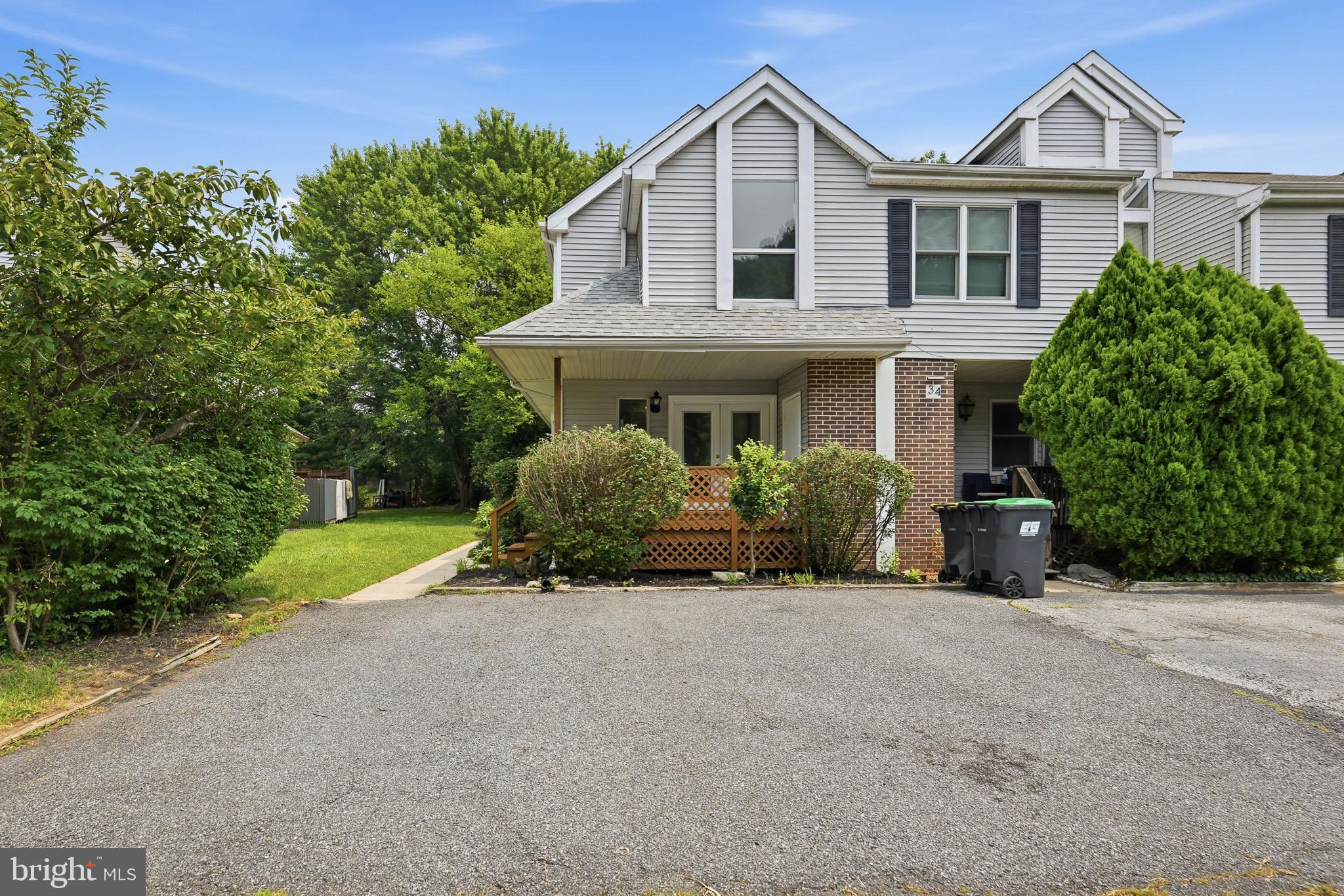 Welcome to this beautifully maintained end-unit townhome in Cedar Pointe. Freshly painted throughout with brand-new carpeting, this move-in-ready home combines thoughtful updates with pride of ownership. The main level features a functional layout with a spacious kitchen, dining room overlooking the step-down living room, complete with a cozy fireplace. Recent improvements include freshly stained kitchen cabinets and bathroom vanities, giving the home a refreshed, modern feel. Upstairs, you'll find three generously sized bedrooms with ample closet space and a hall bathroom. The unfinished basement provides excellent storage space and the opportunity to customize it to fit your needs. Step outside onto the recently replaced rear deck, perfect for enjoying your morning coffee or unwinding after a long day. As an end unit, the home offers added privacy, and with two dedicated parking spaces, convenience is built right in. Lovingly maintained over the years, this home is truly move-in ready and waiting for its next owner.