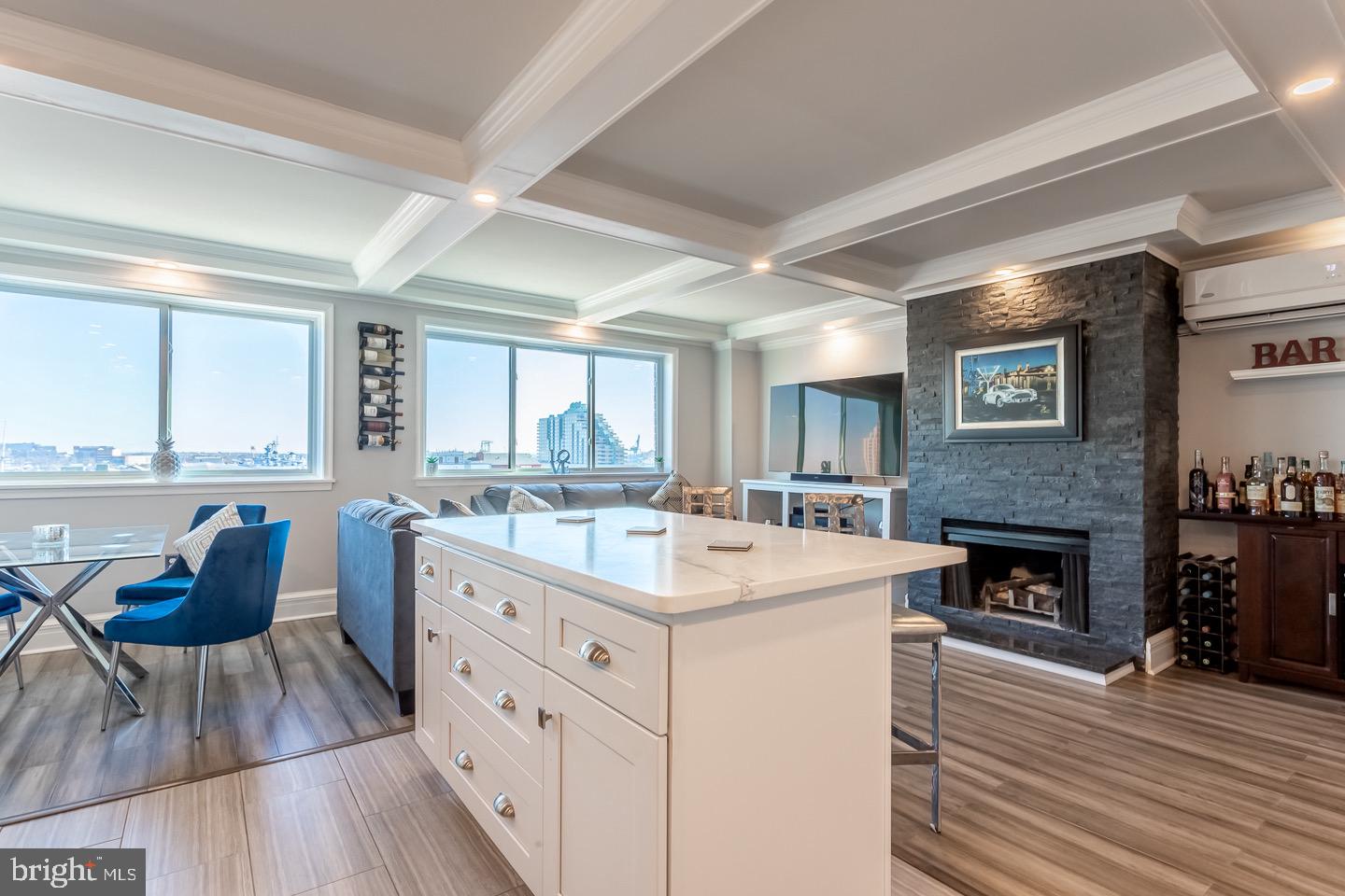 Move right into this fully renovated top-floor bi-level condo in the heart of Head House Square, offering sweeping city and river views from your private balcony.

The main level features an open-concept layout with a spacious living area centered around a custom stone fireplace, a sleek powder room, and a defined dining space. The updated kitchen is designed for both everyday living and entertaining, complete with Calacatta quartz countertops, subway tile backsplash, breakfast bar, white shaker cabinetry, pantry storage, and stainless steel appliances.

Upstairs, the oversized primary suite offers two large walk-in closets, a flexible seating or work-from-home area, and direct access to the balcony. The bathroom has been thoughtfully renovated with a double marble vanity, custom walk-in shower, and in-unit laundry.

Additional upgrades include Pella hurricane-rated/soundproof windows and doors, new ductless A/C units on both levels, coffered ceilings, and newly upgraded appliances.

Abbotts Square residents enjoy access to a renovated fitness center and a quiet, landscaped courtyard.

Located just steps from Head House Square, you’re surrounded by some of the city’s best restaurants, cafes, and waterfront attractions - including Spruce Street Harbor Park.

A turnkey unit in one of Philadelphia’s most desirable neighborhoods—schedule your showing today.