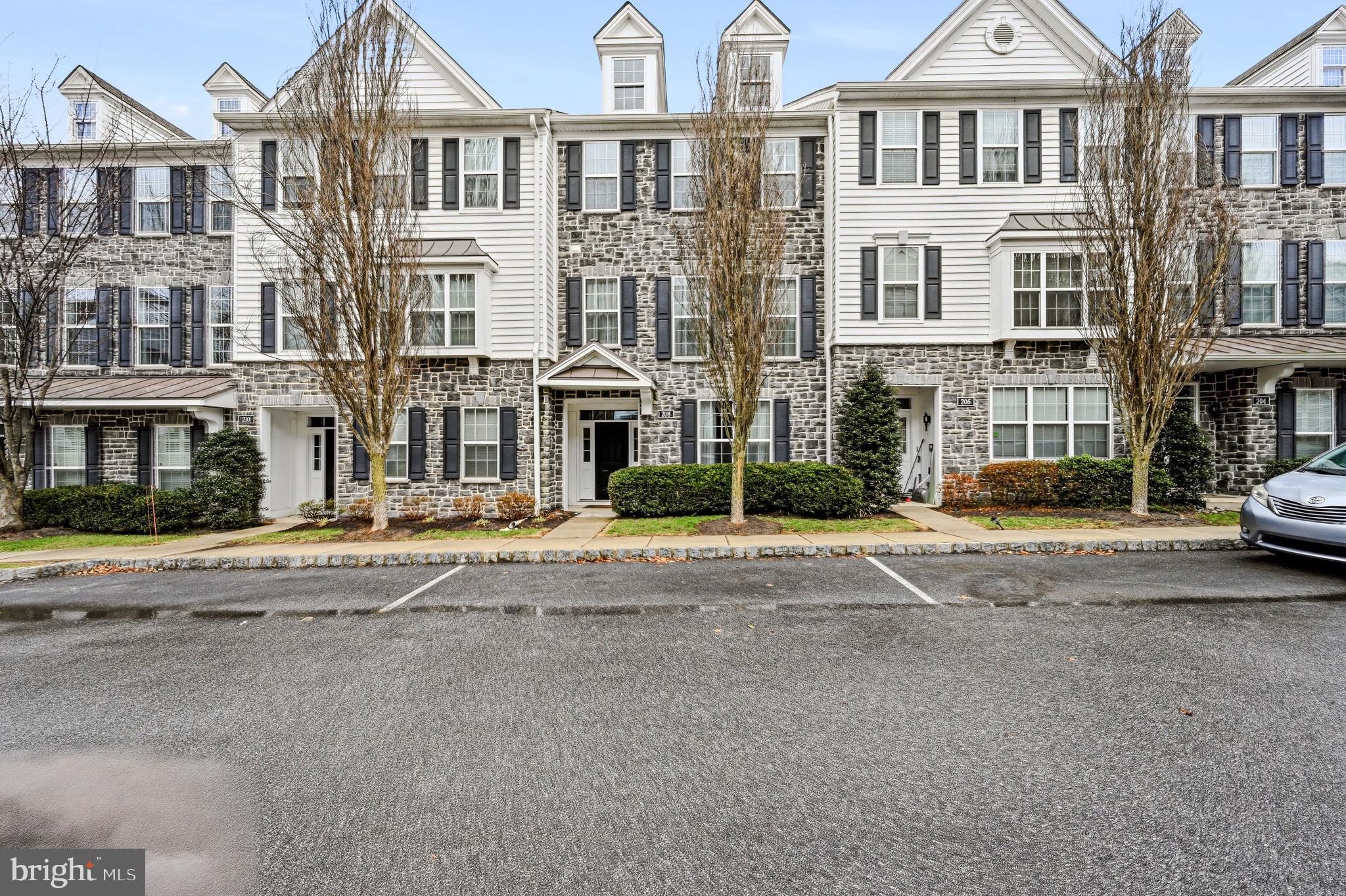 Priced to sell! 208 Jackdaw Aly, also known as 208 Murray Lane, offers comfortable three-level townhome living in the Ravenscliff community of Media. This home features 3 bedrooms, 2.5 baths, approximately 2,214 square feet, an attached 2-car garage, a first-floor flex room, and an open main level designed for everyday living and entertaining. 

Step inside to a bright layout with 9-foot ceilings on the main level and in the first-floor bonus room. The open floor plan connects the living, dining, and kitchen areas for an easy flow throughout the main living space. Maple hardwood floors, recessed lighting, and generous natural light add warmth and function.

The kitchen features white cabinetry with crown molding, a glass-front accent cabinet, granite countertops, a white subway tile backsplash, stainless steel appliances, a gas cooktop, and a large island workstation with a prep sink. Just off the main living area, a covered composite deck provides outdoor space for dining, grilling, or relaxing.

The finished first-floor bonus room offers flexible space for an office, fitness area, media room, hobby room, or additional living space. The attached 2-car garage provides direct interior access and storage options.

Upstairs, the primary suite includes a vaulted ceiling, walk-in closet, and a bath with a glass shower, soaking tub, double vanity, and upgraded floor tile. Two additional bedrooms also feature vaulted ceilings. The second-floor laundry area adds convenience. 

Ravenscliff offers low-maintenance living, with exterior maintenance, lawn care, snow removal, and trash service covered by the condo association. The location provides convenient access to Route 1, Route 476, downtown Philadelphia, Philadelphia International Airport, downtown Media, the Media-Wawa SEPTA Regional Rail line, Ridley Creek State Park, shopping, dining, cafés, entertainment, and local events.

208 Jackdaw Aly offers space, comfort, and convenience in a well-located Media townhome community. Schedule your showing today.  One or more photos have been virtually staged.