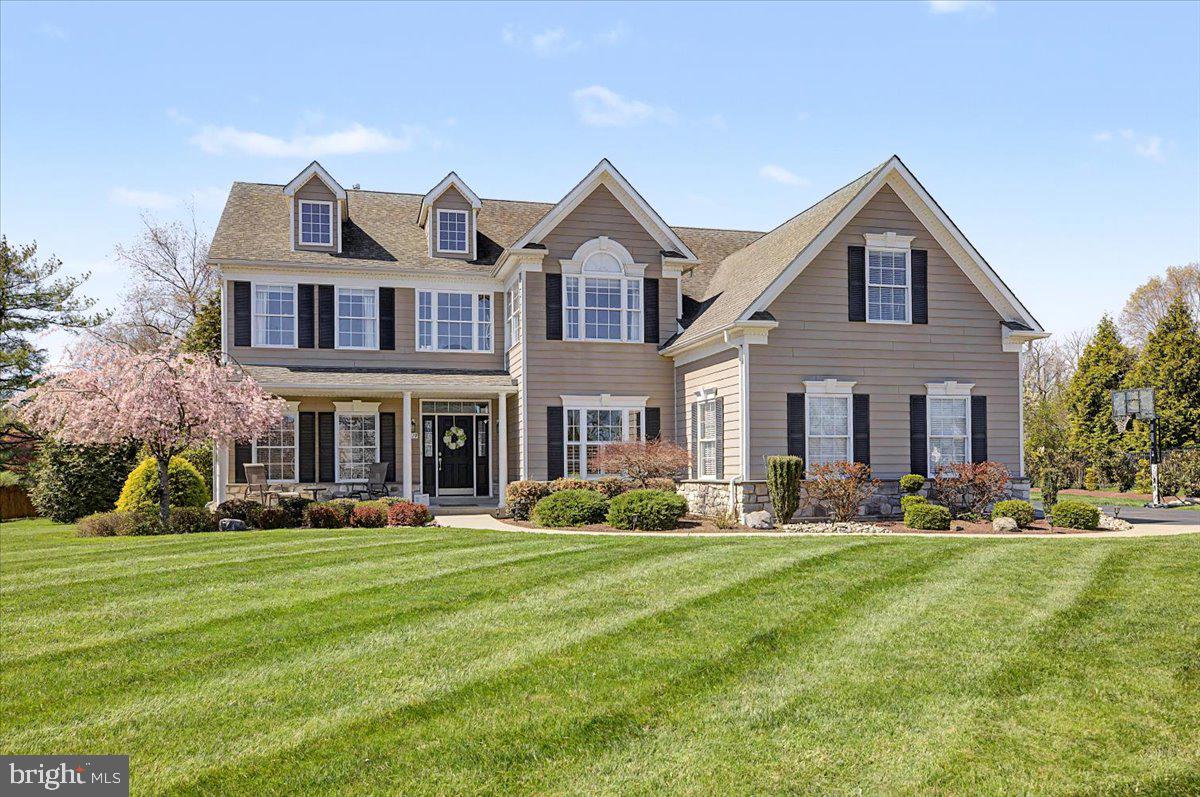 Welcome to this beautifully appointed four-bedroom, 3.5 bath, two-story colonial in the highly sought-after Ridings of Warwick within the Central Bucks School District. A grand foyer with hardwood floors greet you, along with elegant trim work and rich moldings that elevate the home’s style, all complemented by a neutral palette ready to suit any design aesthetic.
To the right of the entry is a private study that offers the perfect work-from-home retreat with views of the lovely landscape. Looking to the .left when you enter the home, a sun-filled living room flows seamlessly into the dining room and into the kitchen—the true epicenter of the home, creating an effortless layout for everyday living and entertaining. Gas stovetop cooking ( with a downward draft), double ovens, and plenty of counter space.. The owners thoughtfully opened the wall between the dining room and kitchen offering flexibility between living spaces. 
The great room is the heart of the home, featuring a soaring vaulted ceiling with architectural beam-style trim and a stunning wall of windows that fills the space with natural light. Whether it’s cozy nights by the gas fireplace or gathering with friends and family, this room delivers unforgettable moments.
The finished basement is an entertainer’s dream, offering almost 1,000 square feet of additional living space complete with a personal (heated) gym, bar area, full-bath, and custom  Bilco doors that bring in natural light, transforming the lower level into a bright, inviting extension of the home.
Upstairs, you’ll find four bedrooms, including a spacious owner’s suite with a versatile sitting area—ideal for relaxing, working, or creating a personal fitness space. The en-suite bath features a soaking tub, glass-enclosed shower, and expansive ceramic tile. Three additional bedrooms share a well-appointed full bath.
Outdoor living is just as impressive, with a beautiful teak deck and custom pergola that steps down to a paver patio with a built-in fire pit—perfect for entertaining on cooler evenings.
Set against the picturesque backdrop of Bucks County, the rear of the home overlooks a generational farm, where chickens and goats can sometimes be seen, orchard trees are beginning to grow, and a stone farmhouse reflects the timeless character of the land. This is a home where comfort, design, and location come together.
Close proximity to restaurants, shops, brewery with local events and stunning views.
Easy access to all travel routes.