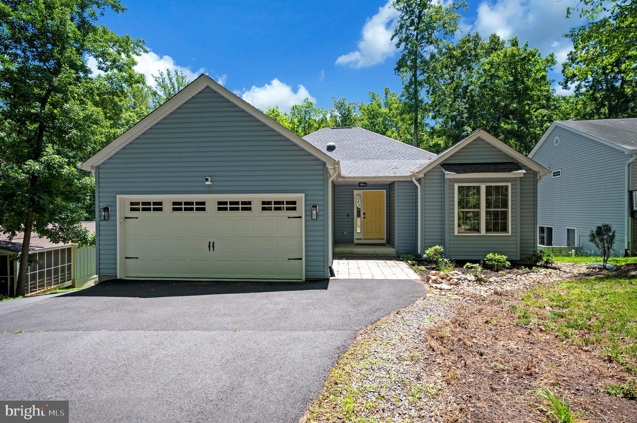 Welcome to 708 Eastover Parkway, where modern design, flexible living spaces, and thoughtful upgrades come together in one exceptional home. Built in 2021 and offering more than 3,000 square feet, this 4-bedroom, 3-bath contemporary rambler is perfectly situated within the sought-after Lake of the Woods community. Step inside and discover an open-concept layout designed for both everyday comfort and effortless entertaining. At the center of it all is an impressive kitchen featuring state-of-the-art appliances, a massive center island, and a unique prep kitchen that makes hosting gatherings or preparing family meals a breeze. Cathedral ceilings soar above the living room, where a cozy gas fireplace creates a welcoming focal point. Whether you're enjoying a formal dinner in the dining room, a casual meal in the breakfast nook, or morning coffee at the breakfast bar, you'll appreciate the variety of spaces designed to fit your lifestyle. The main-level primary suite offers a private retreat complete with a walk-in closet, ensuite bath, and a bonus sitting room that can easily serve as a home office, nursery, dressing room, or quiet escape. A second bedroom and full bath on the main level provide additional convenience and privacy for guests or family members. The finished walkout basement expands the possibilities with two additional bedrooms, a full bath, a media and game room, and a versatile flex space. Whether you're accommodating multi-generational living, creating a private guest area, or exploring income-producing opportunities, this lower level offers incredible flexibility. A large unfinished area provides even more room for storage or future customization. Outdoor living is equally inviting with two screened-in porches that offer the perfect setting to relax and unwind. A professionally installed retaining wall enhances the property's appeal, while additional upgrades including solar tube lighting, a whole-home surge protector, and an air scrubber add comfort and peace of mind. Beyond the home, Lake of the Woods delivers a lifestyle unlike any other. This private gated community offers two lakes, a golf course, an equestrian center, fire and rescue services, and a church, along with endless opportunities for recreation and connection. Spend your days boating, water skiing, kayaking, golfing, relaxing at the beaches, or enjoying the scenic views from the clubhouse. With more than 60 clubs and organizations, there are countless ways to pursue your interests, meet neighbors, and become part of the community.

Located in Orange County, residents also benefit from lower real estate taxes while enjoying access to one of the region's most desirable communities. Whether you're searching for a full-time residence or a weekend getaway, 708 Eastover Parkway offers the space, style, and lifestyle you've been looking for. Come experience firsthand what makes Lake of the Woods such a special place to call home.