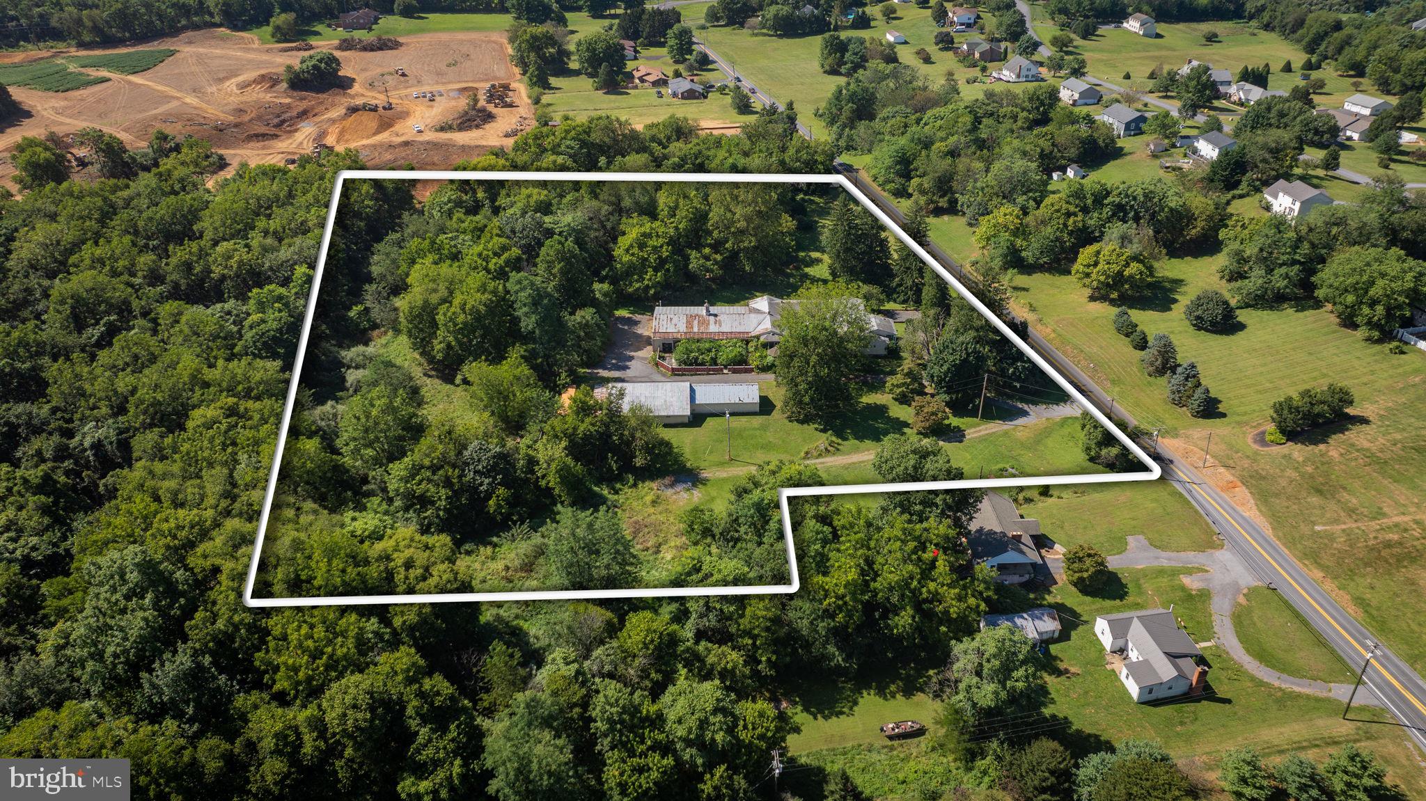 Prime 8-Acre Opportunity with Public Utilities & Massive Garage Space – Development Potential!

Unlock the possibilities with this rare 8-acre parcel offering public water and sewer access, making it ideal for future development or a private estate with room to expand. Located on a highly visible stretch with excellent road frontage, this property combines accessibility with versatility.

Currently improved by a house in need of renovation, the value lies in the  outbuildings and land.

 Attached 12-Car Garage with a spacious mezzanine level – perfect for storage, car collection, or conversion to studio/workspace

 Detached 5-Car Garage featuring a dedicated office/workshop area – ideal for contractors, hobbyists, or home-based businesses

Whether you're a developer seeking a prime location, an investor with vision, or a buyer looking for a unique live/work setup, this property delivers unmatched potential.