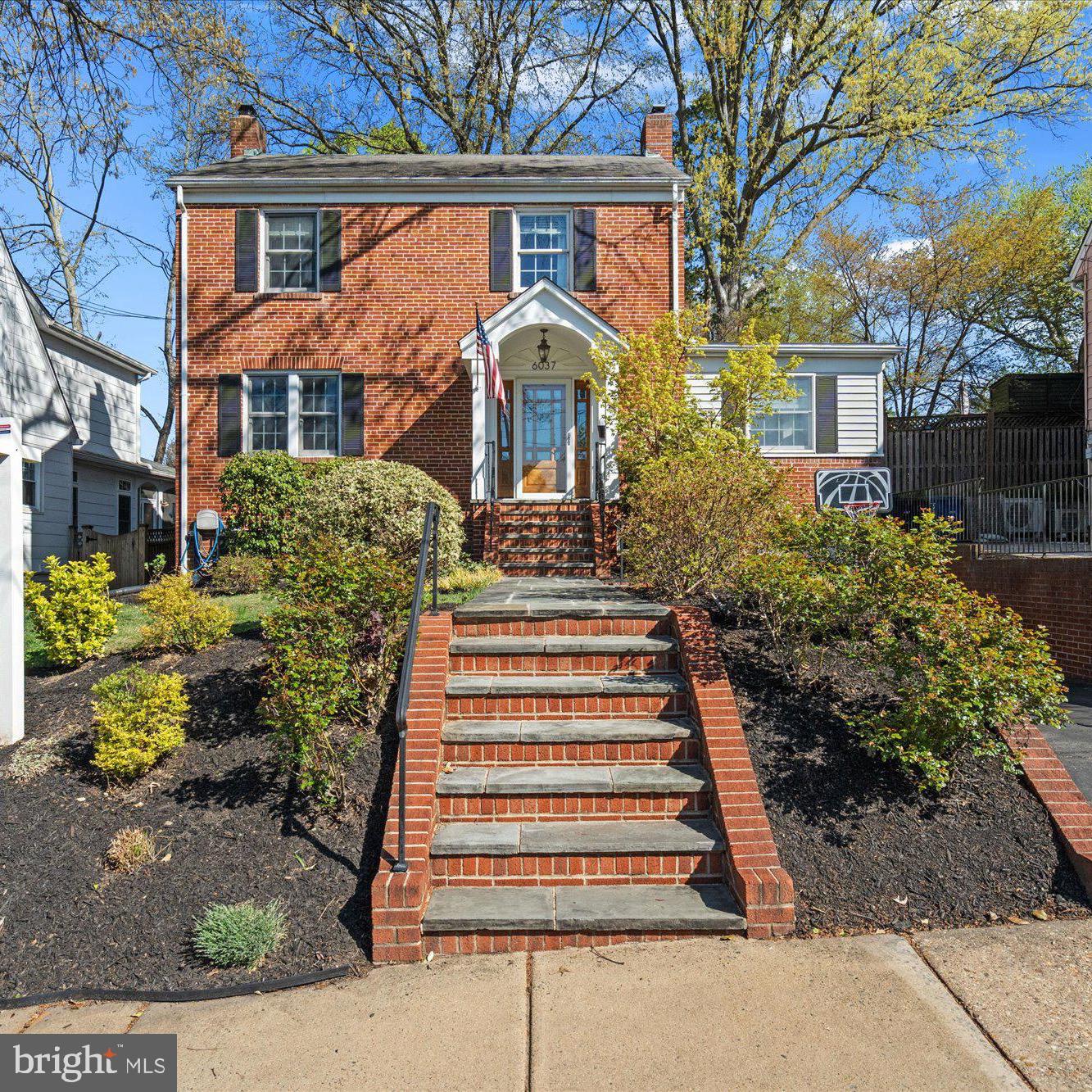 Welcome to this exquisite 4-bedroom, 3.5-bathroom home, featuring a sizable addition and located just 0.9 miles from the East Falls Church Metro. Upon entry from the covered porch, you are greeted by one of three living areas. The spacious living room boasts a wood-burning fireplace and stunning wood floors. Adjacent to the living room is a half bath and a spacious office with elegant built-ins. The light-filled dining room, adorned with charming wainscoting, is ideal for both intimate dinners and large gatherings. The gourmet kitchen is equipped with stainless steel appliances, gas cooking, granite countertops, a pantry area, a coffee bar area, and a breakfast bar with seating for four. The kitchen seamlessly integrates into the large family room. Step out onto the lovely patio, leading to the fully fenced, flat backyard, complete with a storage shed. Upstairs, you will find four bedrooms and two full bathrooms. The primary suite is a true spa-like retreat that includes an ensuite bath with dual sinks, ample storage, a walk-in closet, and plantation shutters. The lower level features the third living area with a second fireplace, a substantial laundry room, access to the one-car garage, and a large bonus room currently utilized as a gym. This home is conveniently located in the heart of Arlington, providing close proximity to shops, restaurants, parks and. The metro.