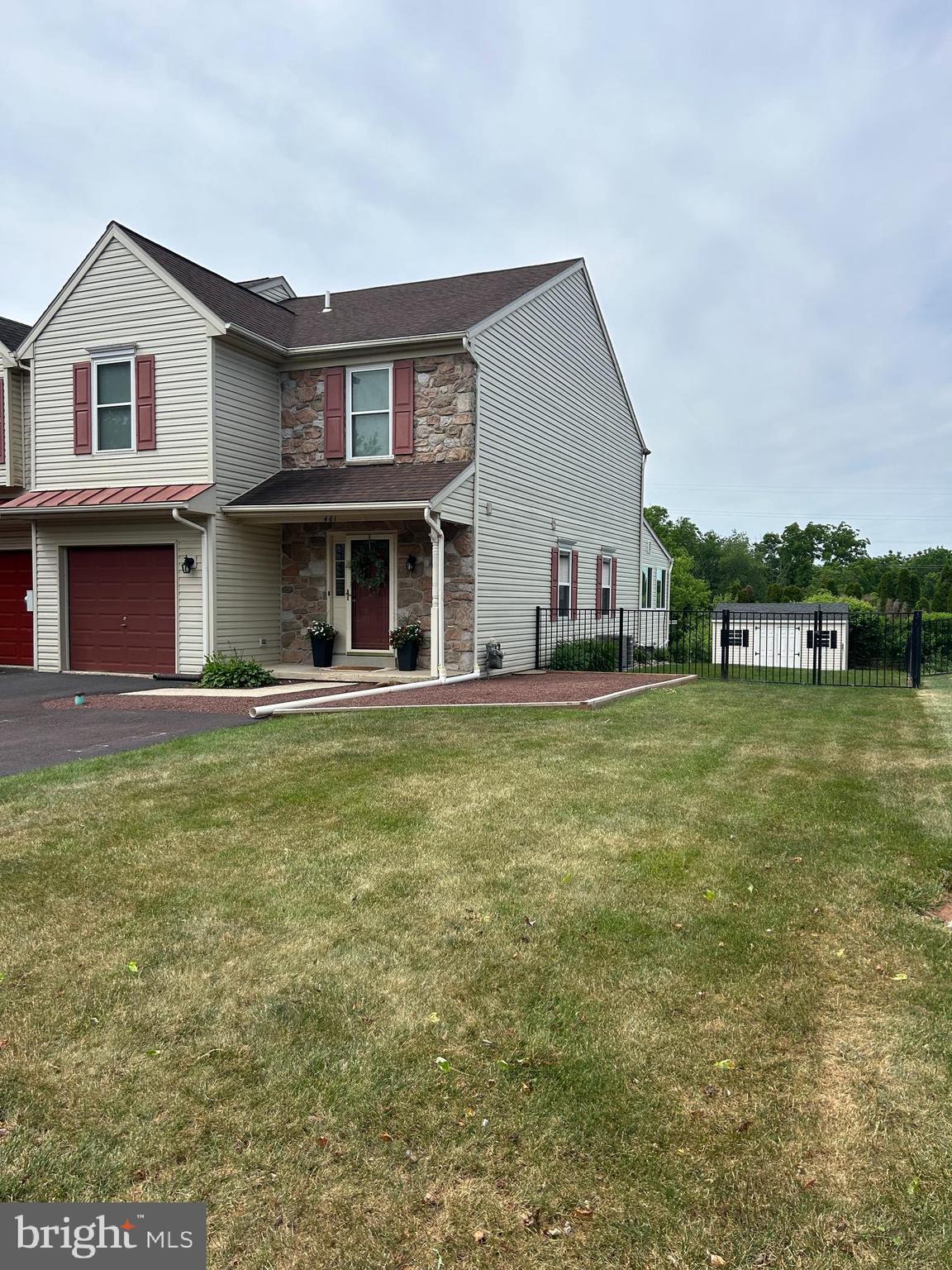 Professional Photos expected 6/25/26!

Welcome to 461 Berkshire Drive, a meticulously updated end-unit townhome in Banbury Crossing within the highly regarded Souderton Area School District. This property offers the distinct advantage of no HOA fees. Set apart from many neighboring homes, it features a double-wide driveway accommodating 3–4 vehicles, a one-car garage, and an expansive fully fenced backyard, approximately twice the size of typical lots, backing directly to Township-maintained open space for enhanced outdoor enjoyment  

The interior presents an open and inviting layout with durable solid-surface flooring throughout the main level and abundant natural light. Recent upgrades include a heated four-season room addition (2025), a new deck (2023), a professionally finished basement (2022), replacement windows (2023), a tankless water heater (2024), an updated powder room (2026), and new aluminum fencing.  

Major systems have been thoughtfully maintained, with a roof replacement in 2018 and a new central air conditioning system in 2020, ensuring long-term comfort and peace of mind.  

Upstairs, the primary suite features a vaulted ceiling and ample closet space, complemented by two additional bedrooms, a hall bath, and second-floor laundry. The finished basement provides versatile living space suitable for a recreation room, home office, fitness area, or other functional uses.  

Conveniently located near shopping, dining, parks, and major commuter routes, this residence combines extensive upgrades, generous outdoor space, abundant parking, and the freedom of no HOA fees—representing a rare opportunity in today’s townhome market.