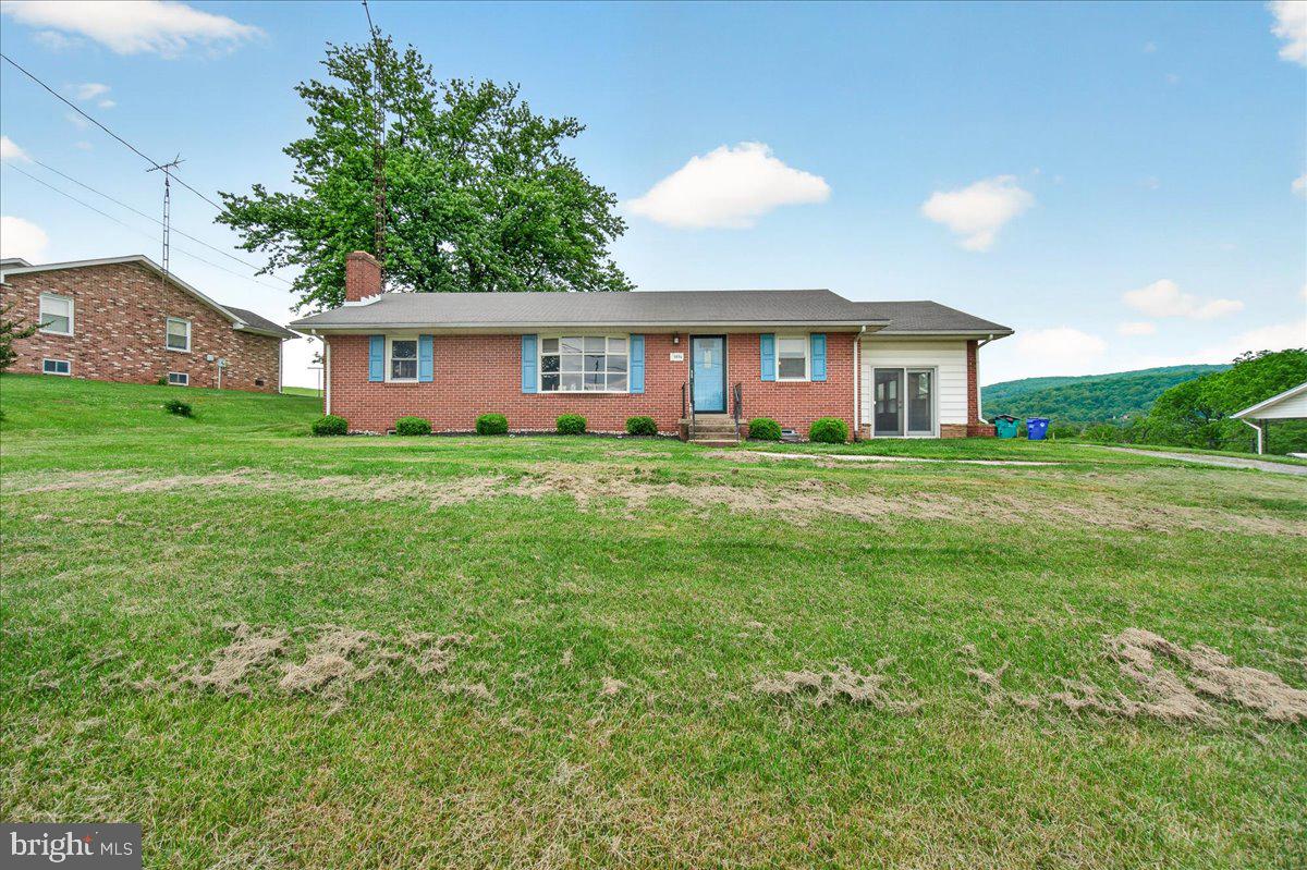 Welcome to 3804 Brethren Church Road in beautiful Myersville! This charming, updated all-brick rancher offers over 2,500 finished square feet of comfortable living space surrounded by breathtaking panoramic views of mountains, valleys, and rolling farmland.
Step inside to a bright and inviting main level featuring gleaming hardwood flooring, neutral paint throughout most of the home, and an open living area filled with natural light. The spacious formal dining room is perfect for gatherings, while the kitchen offers stainless steel appliances, a breakfast bar, and easy flow into the sun-filled sunroom — an ideal spot to enjoy your morning coffee, relax, or entertain guests. Doors from the sunroom lead directly to the expansive lawn and scenic outdoor setting. Three spacious bedrooms and a full bath complete the main level.
The finished lower level provides excellent additional living space with a full bath, large family room with a brick fireplace, second full kitchen, and laundry room with washer and dryer — offering flexibility for guests, extended family, or entertaining.
Outside, the detached single-car garage includes an electric car charger, garage door opener, and ample storage space.
Perfectly positioned in a highly desirable Myersville location known for its small-town charm, scenic beauty, and convenient access to commuter routes, this home offers the perfect blend of tranquility, comfort, and functionality. Come experience the incredible views and peaceful setting that make this property truly special — welcome home!   This property is SOLD- AS IS!